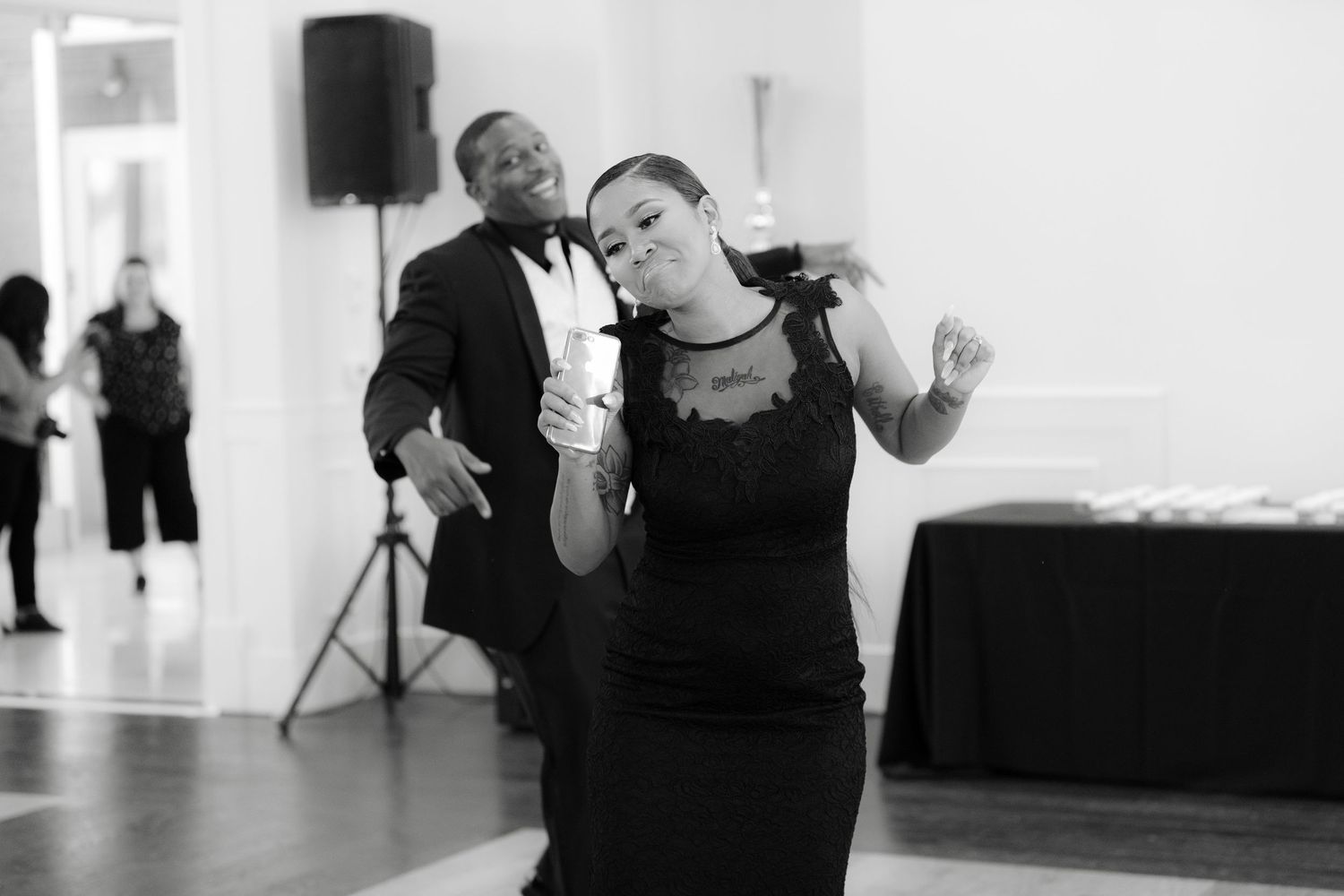 People dancing in a black and white collage of photos showing movement and expression in a dance studio.