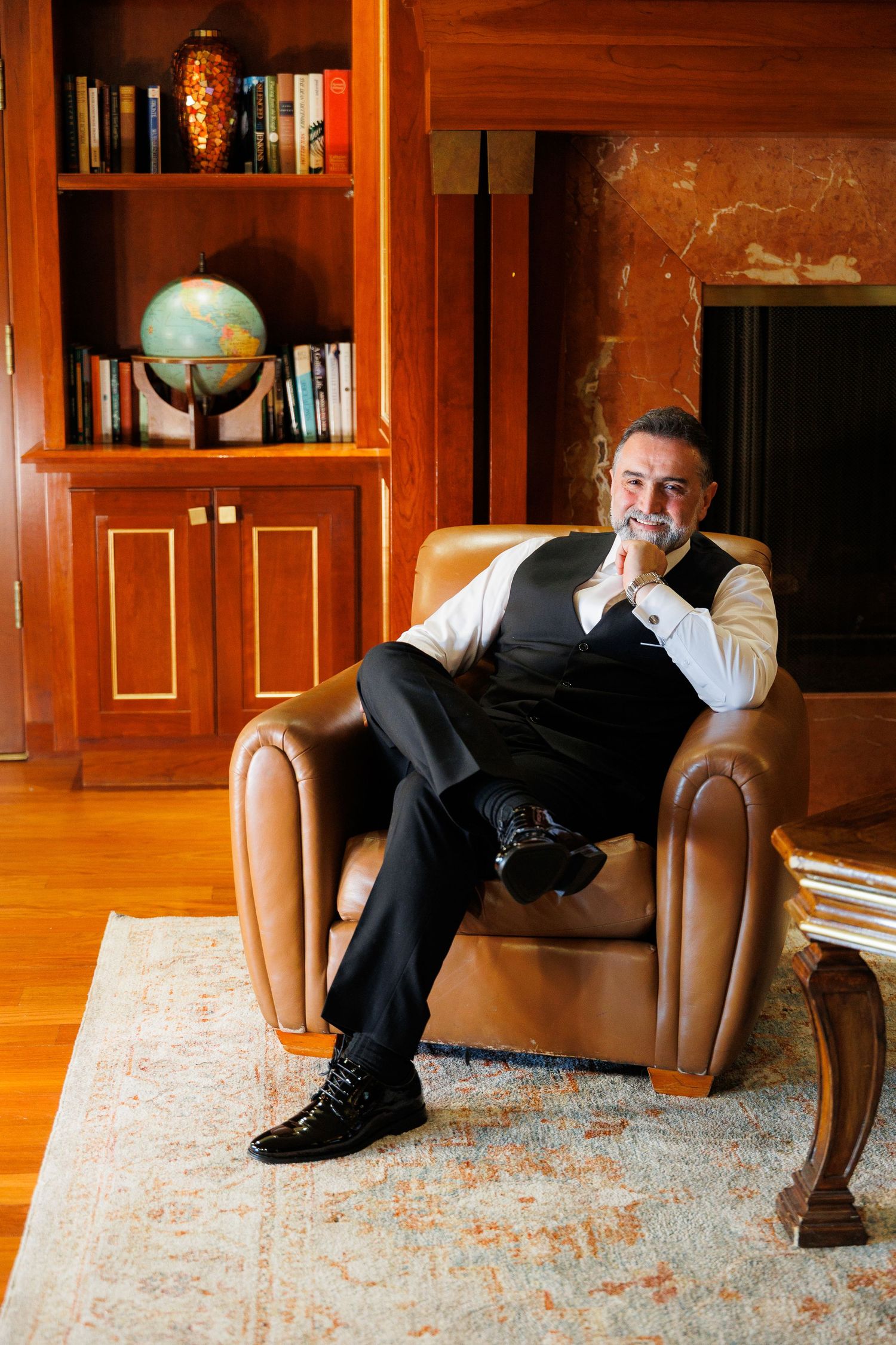 A sequence of photos showing someone rolling across a wooden floor in a library or study with leather chairs.
