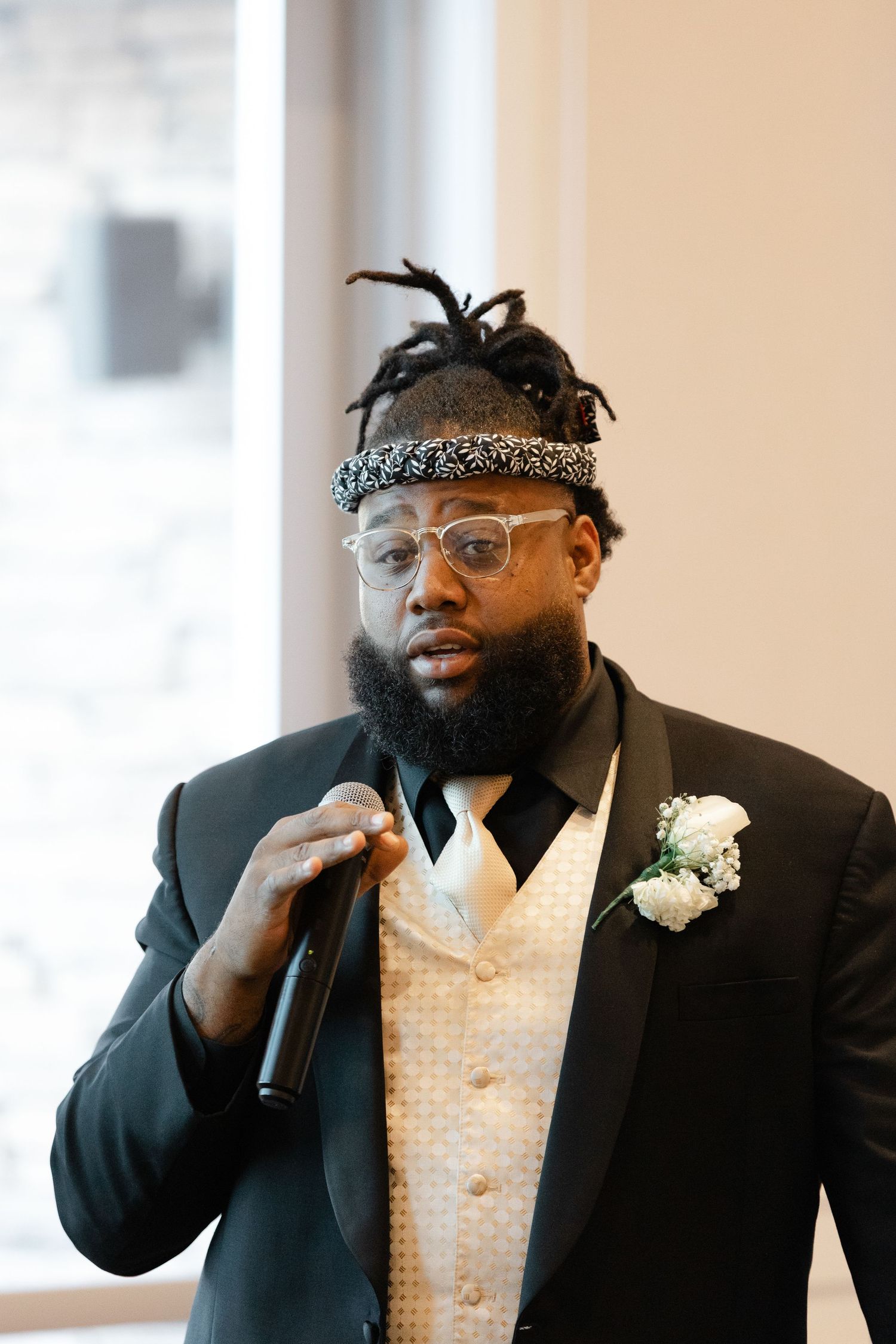 A groom in a black suit with glasses and a patterned bandana shows emotional expressions in a wedding photo collage.
