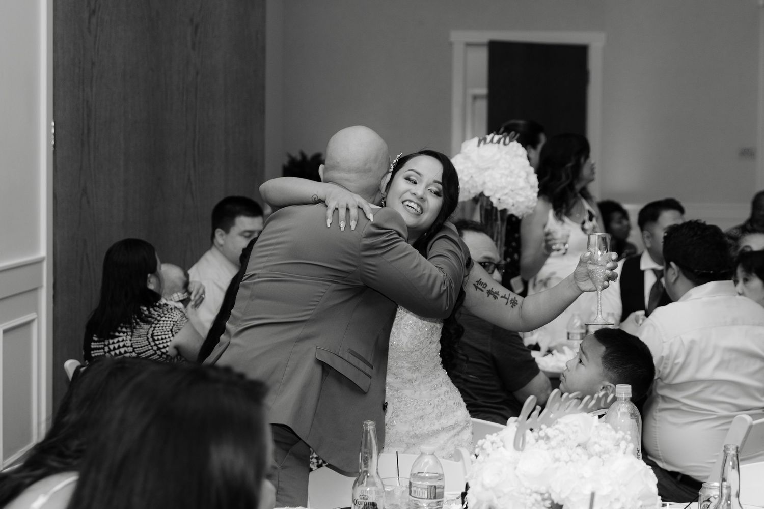 Black and white collage showing intimate moments of a couple dancing and embracing at a wedding reception.