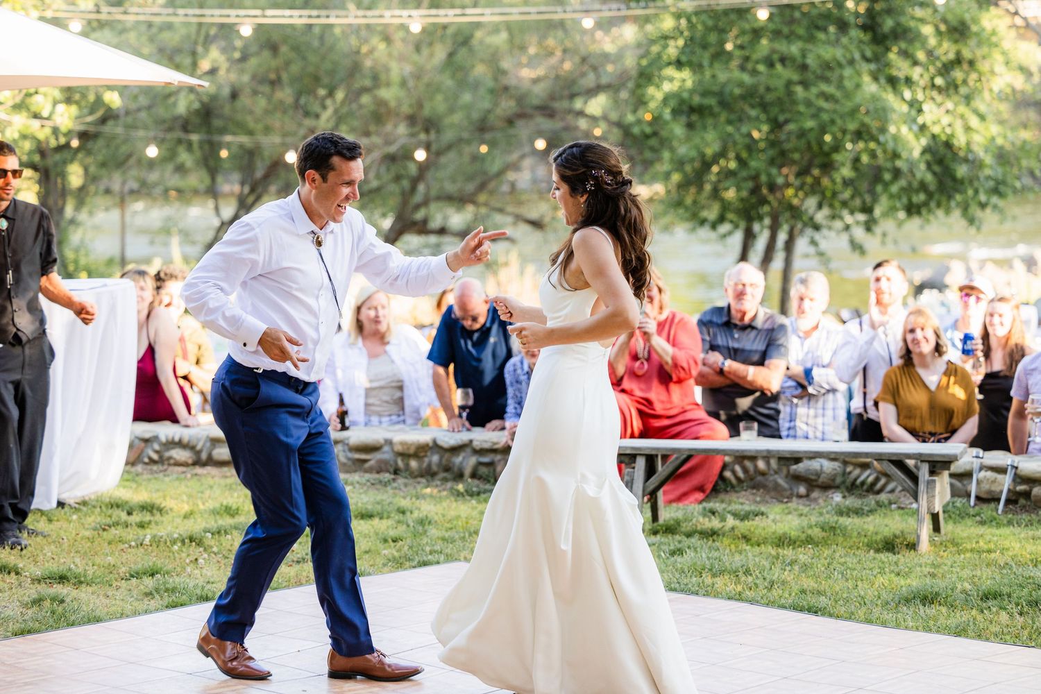A collage of outdoor wedding celebration moments showing dancing, embraces and joyful interactions in a natural setting.