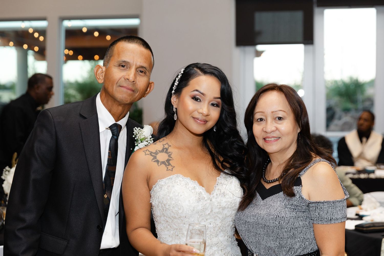 A collection of wedding reception photos showing guests and attendees celebrating at a formal event.