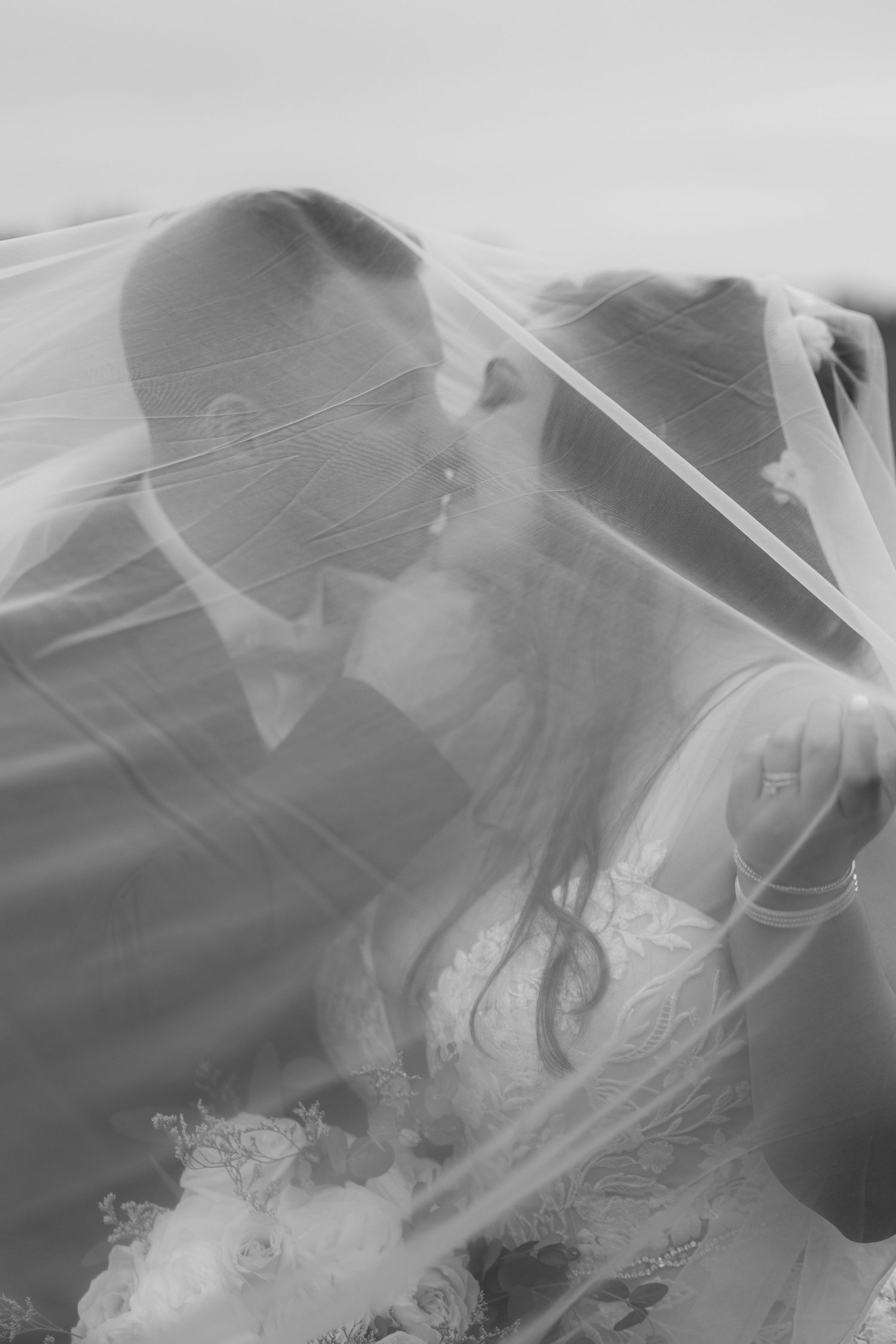 A dreamy black and white sequence of ethereal figures in flowing veils creating an artistic dance-like movement.