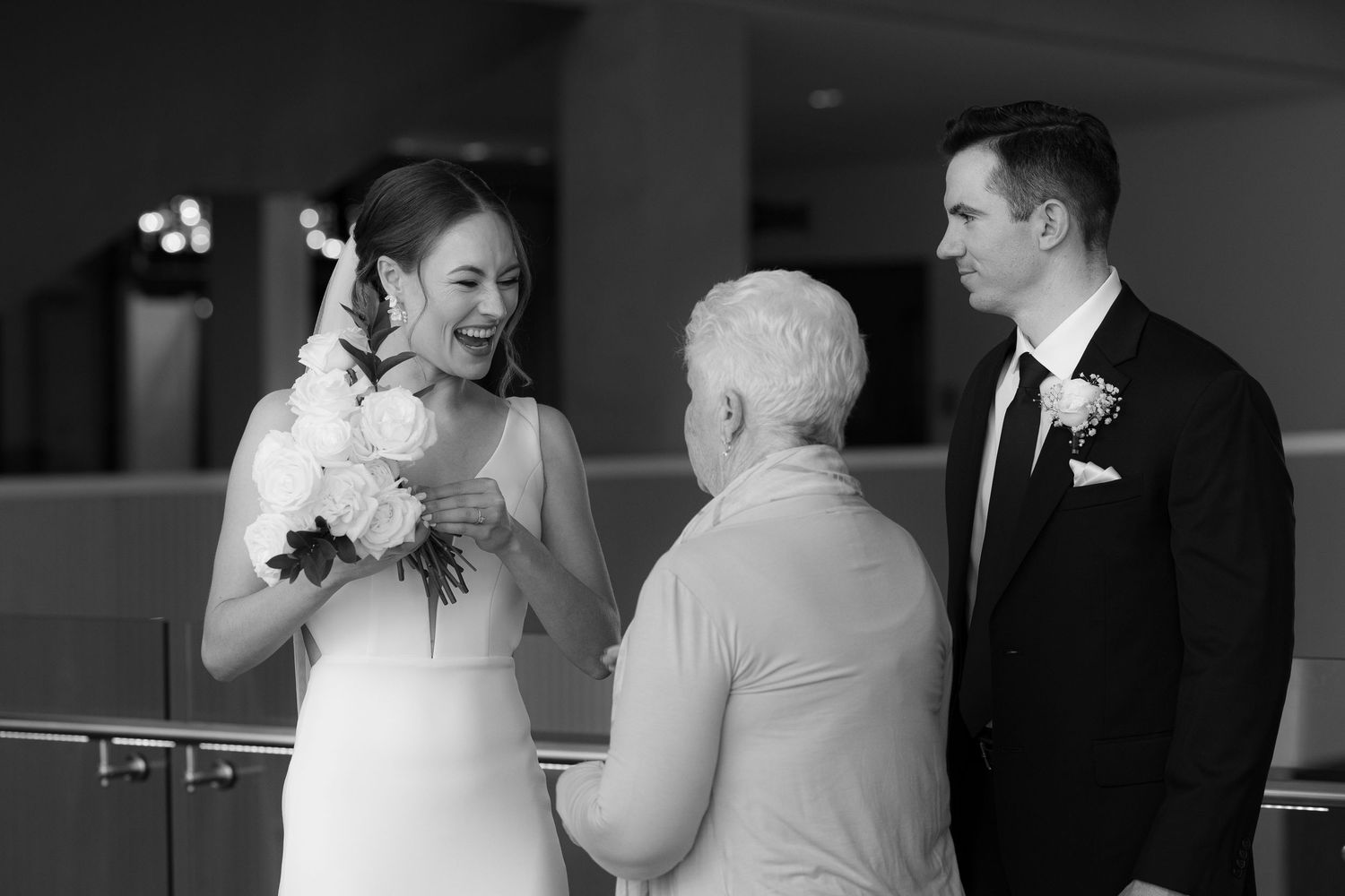 A black and white wedding photo collage showing emotional moments during a reception celebration.