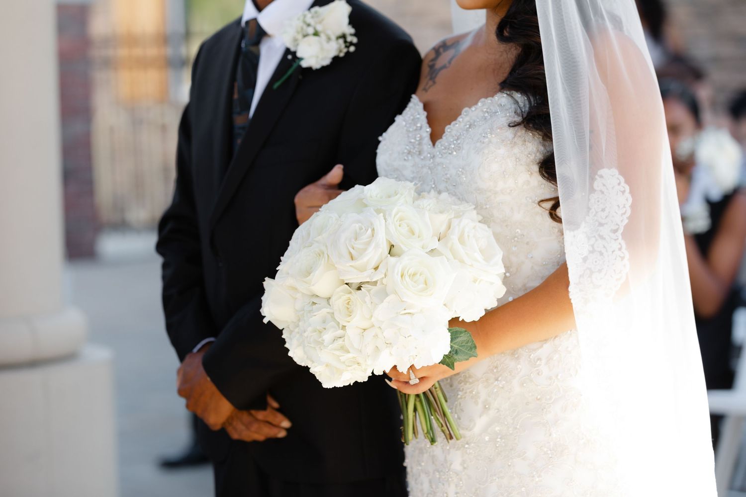 A bride and groom share a romantic moment together during their wedding celebration.