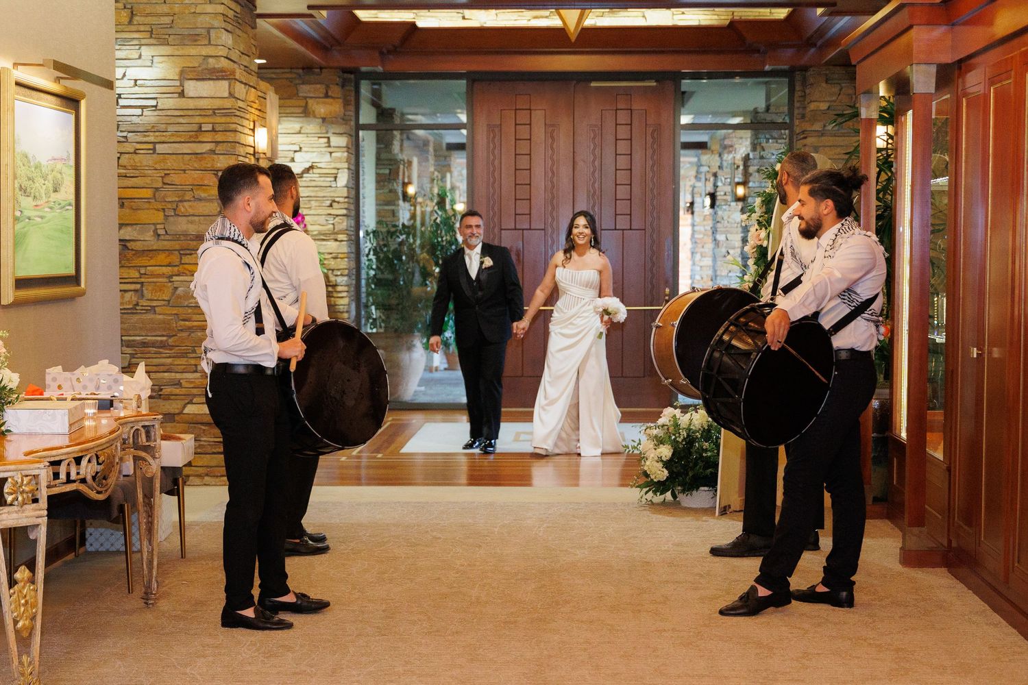Collage of wedding party candid moments showing dancing and celebrations in a rustic indoor venue.