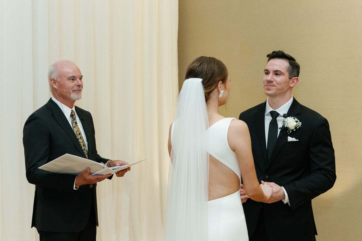 A sequence of wedding photos showing couples dancing and embracing during a formal reception celebration.