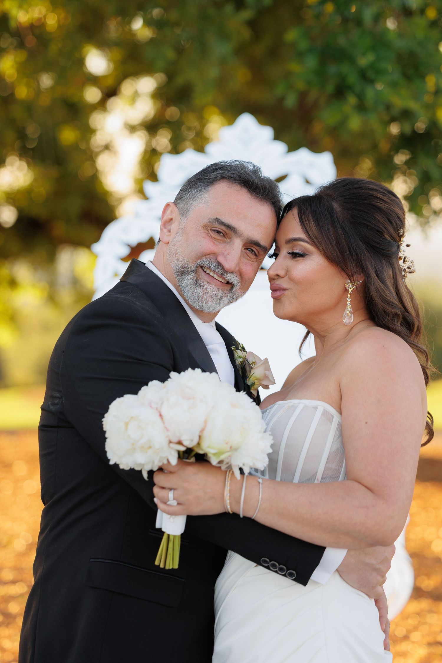A romantic wedding photo sequence shows a couple embracing outdoors with white flowers and autumn foliage in the background.