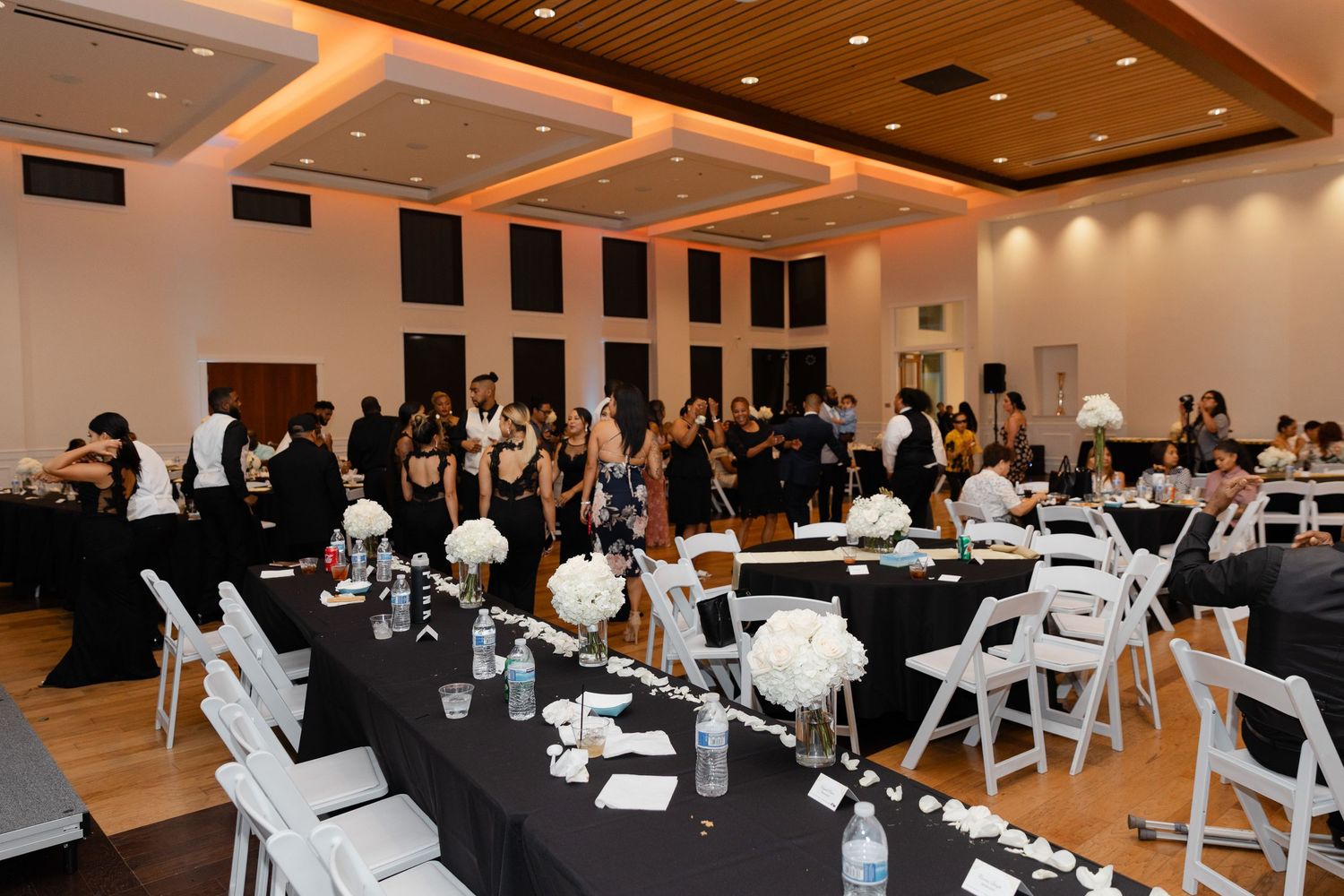 Business professionals seated in rows at a conference room during a corporate meeting or presentation.