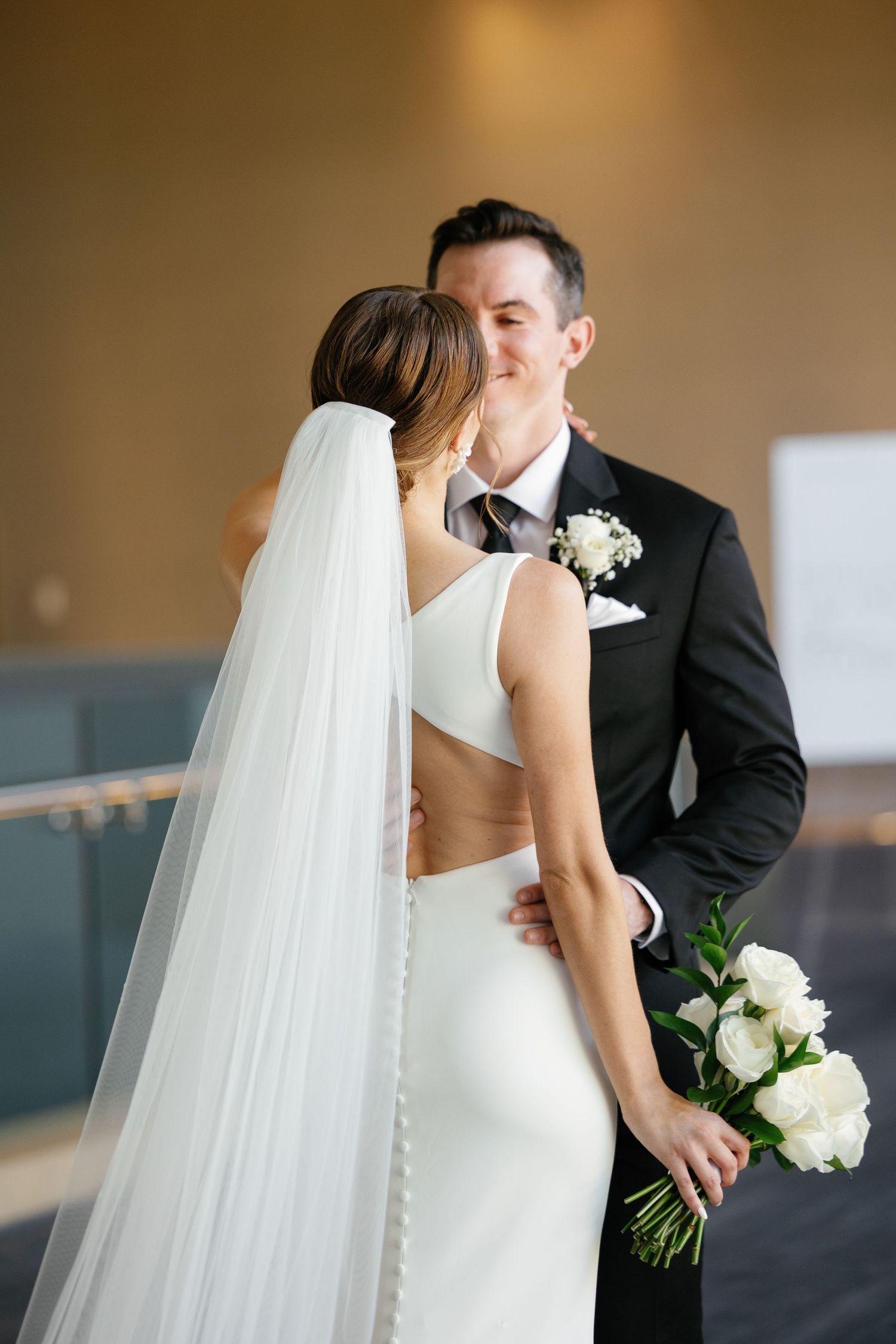 A romantic wedding moment captured in a series of close-up shots showing the bride's flowing veil and white bouquet.