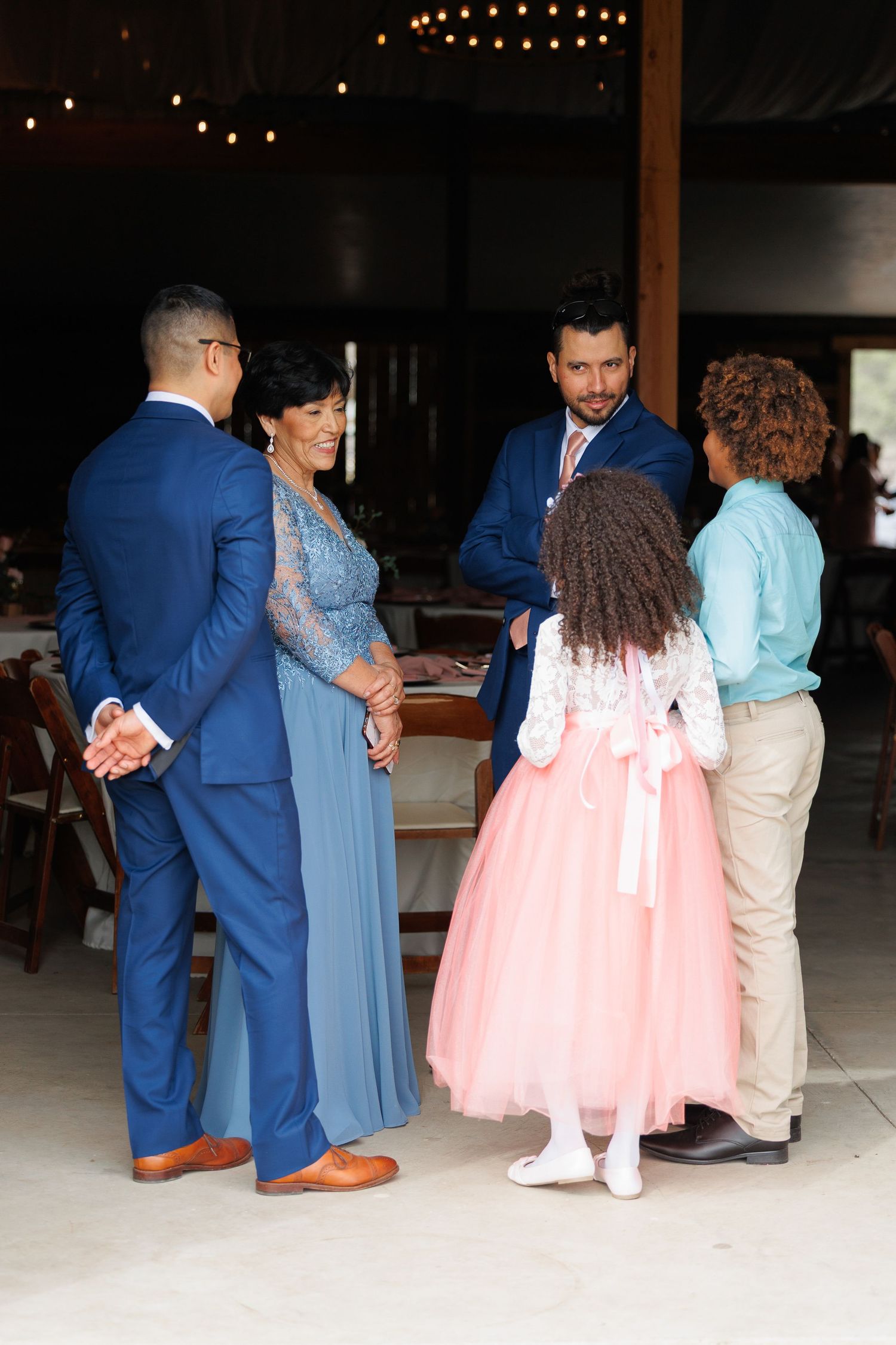 A sequence of photos showing couples dancing at a formal event with blue suits and pink and blue dresses.
