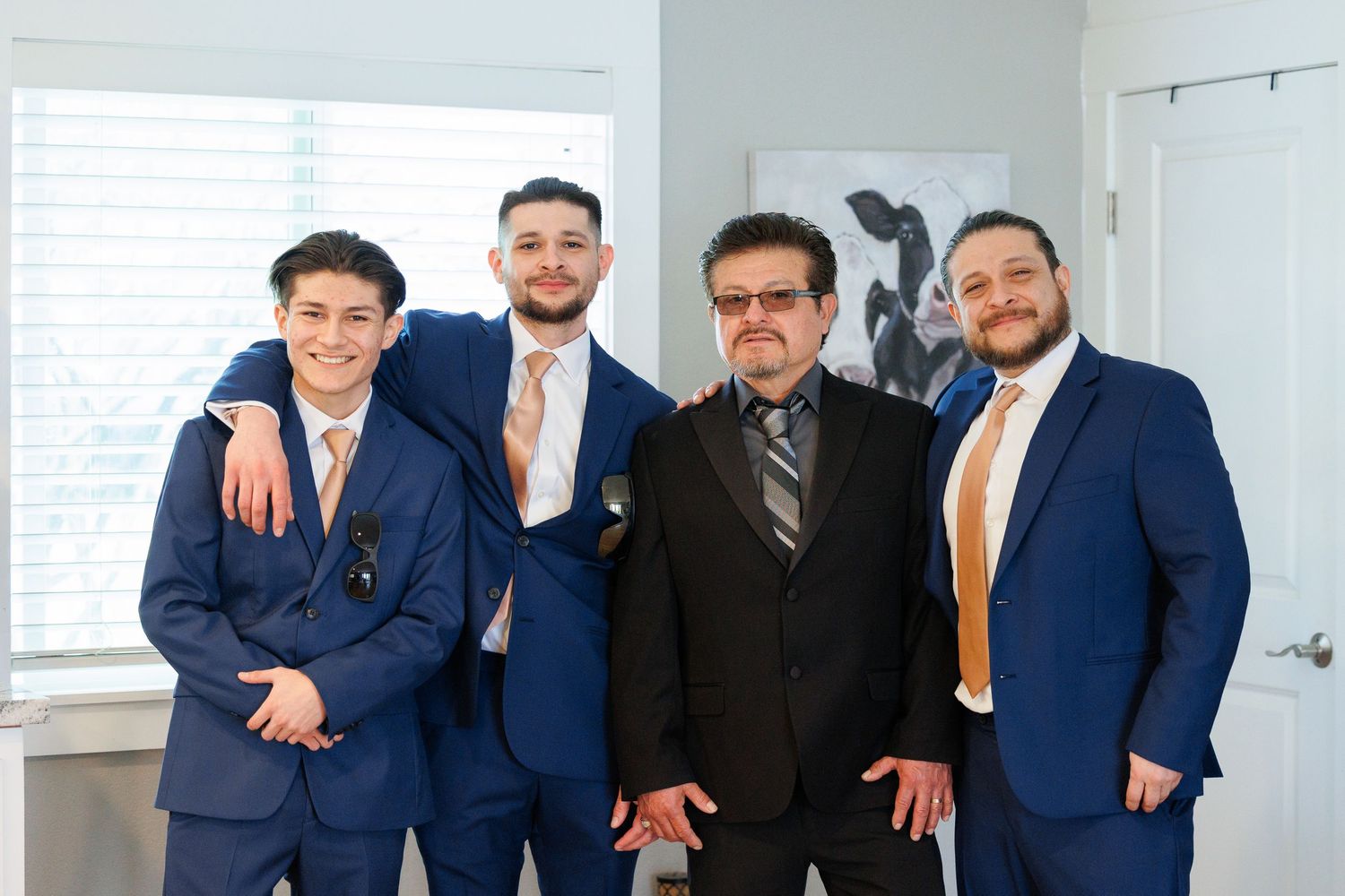 Group of men in formal business attire posing together for a professional photo.