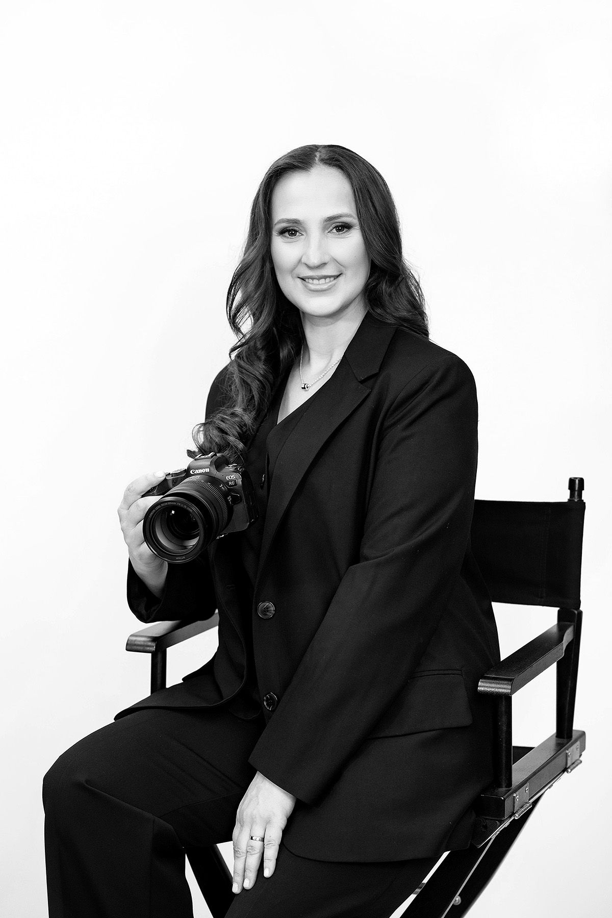 Professional portrait series showing a person in a black blazer seated in different poses against a white background.