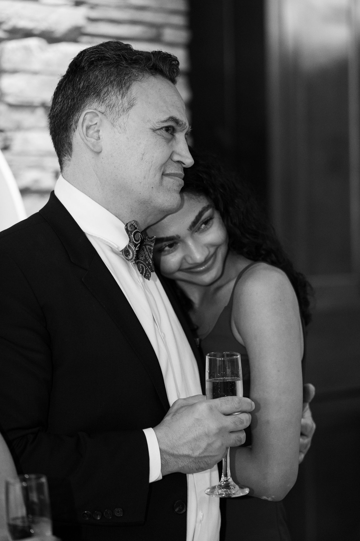 Black and white wedding photo sequence showing tender romantic moments between a couple during a celebration.