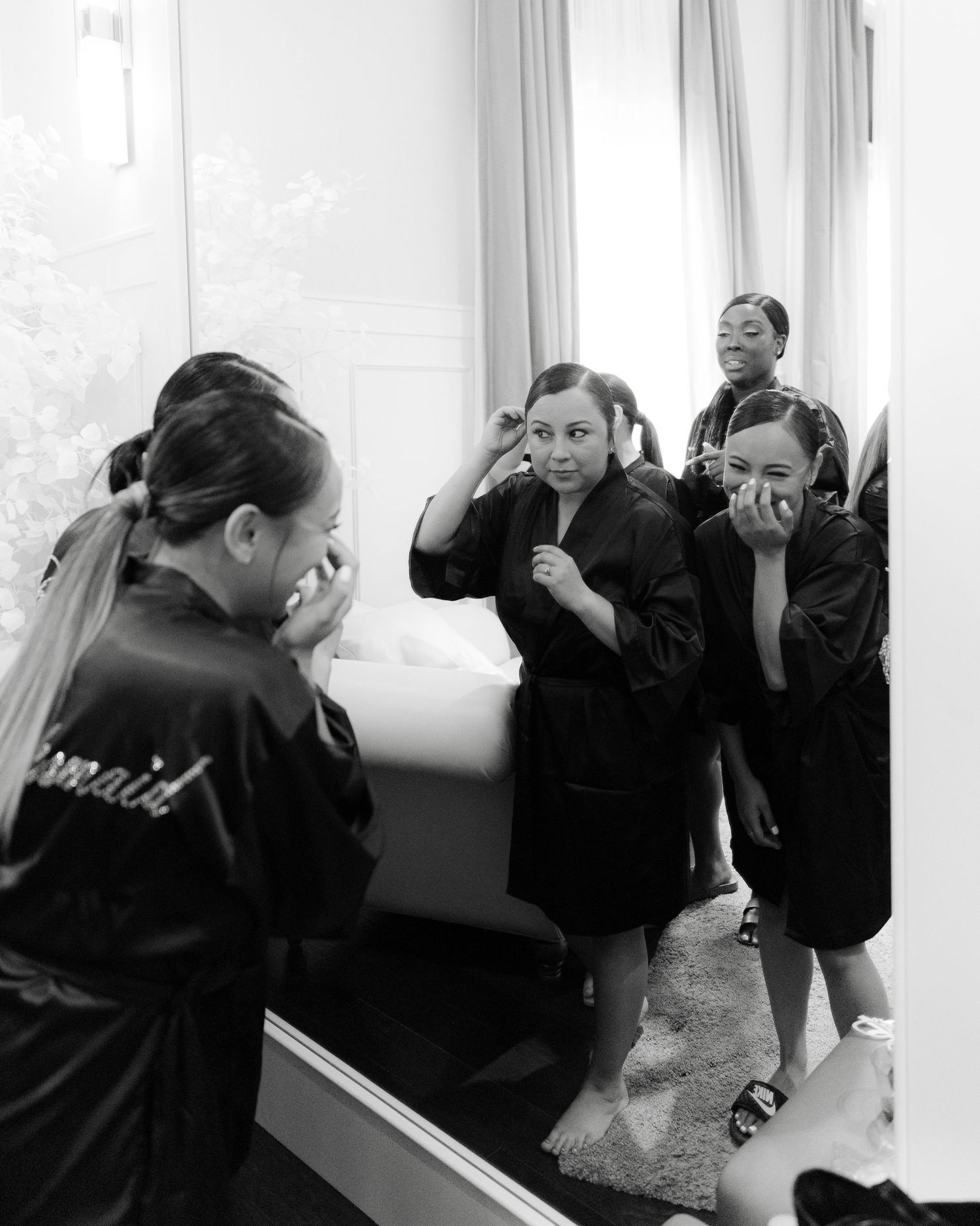 A series of black and white photos showing people leaning against a window sill in various poses.