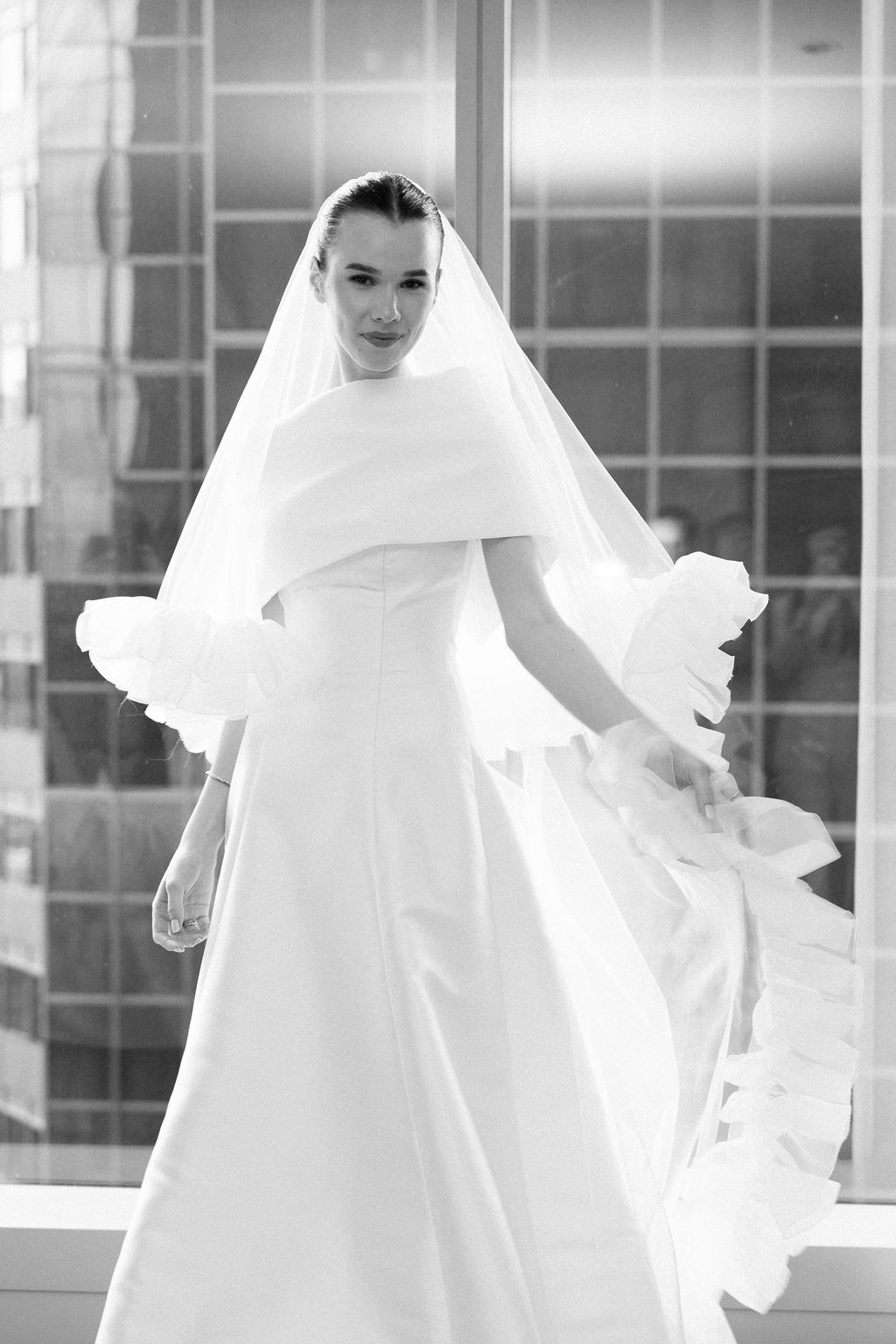 Black and white series of artistic bridal photos featuring minimalist white gown and dramatic veil movement.