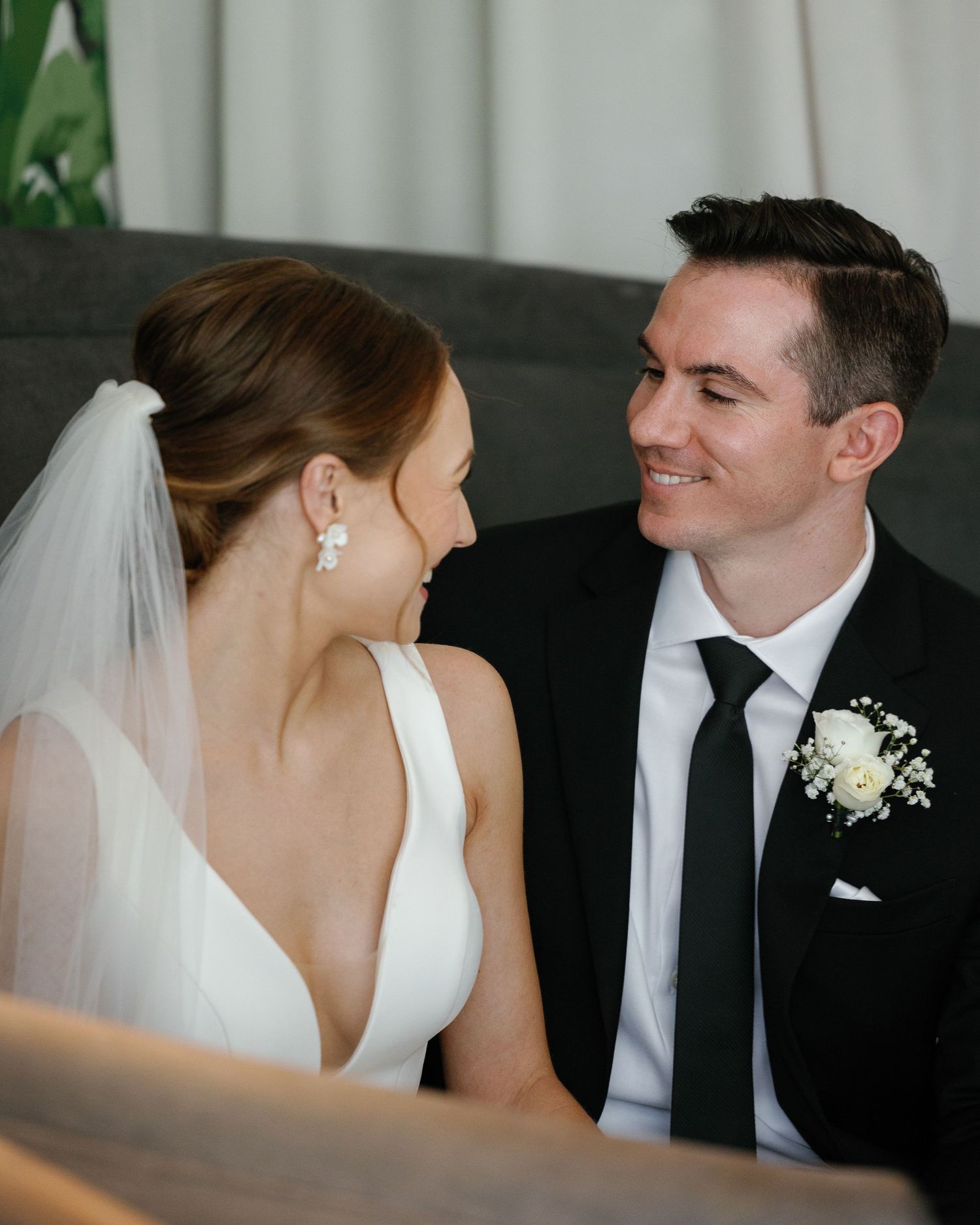 A romantic wedding portrait sequence showing tender moments between newlyweds in black and white formal attire.