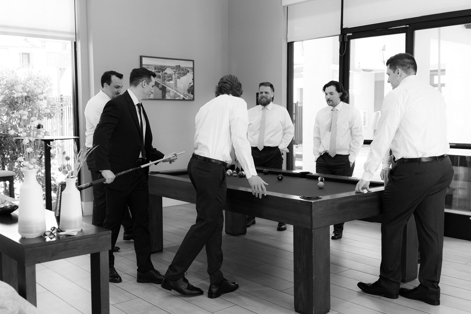 A sequence of black and white photos showing people walking through an office hallway in a repetitive motion study.