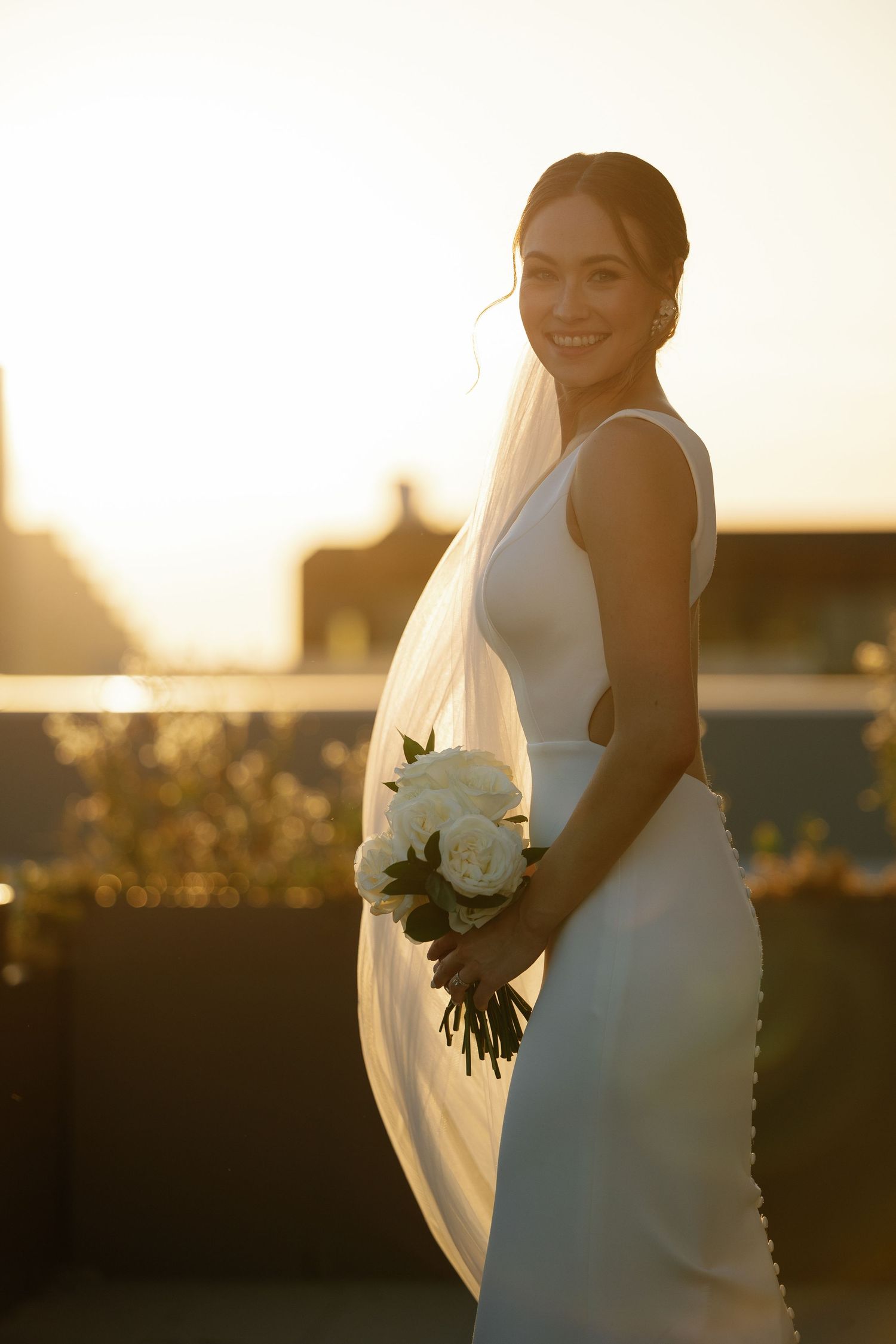 A collection of sunset bridal portraits featuring a white wedding dress and bouquet against a golden sky.