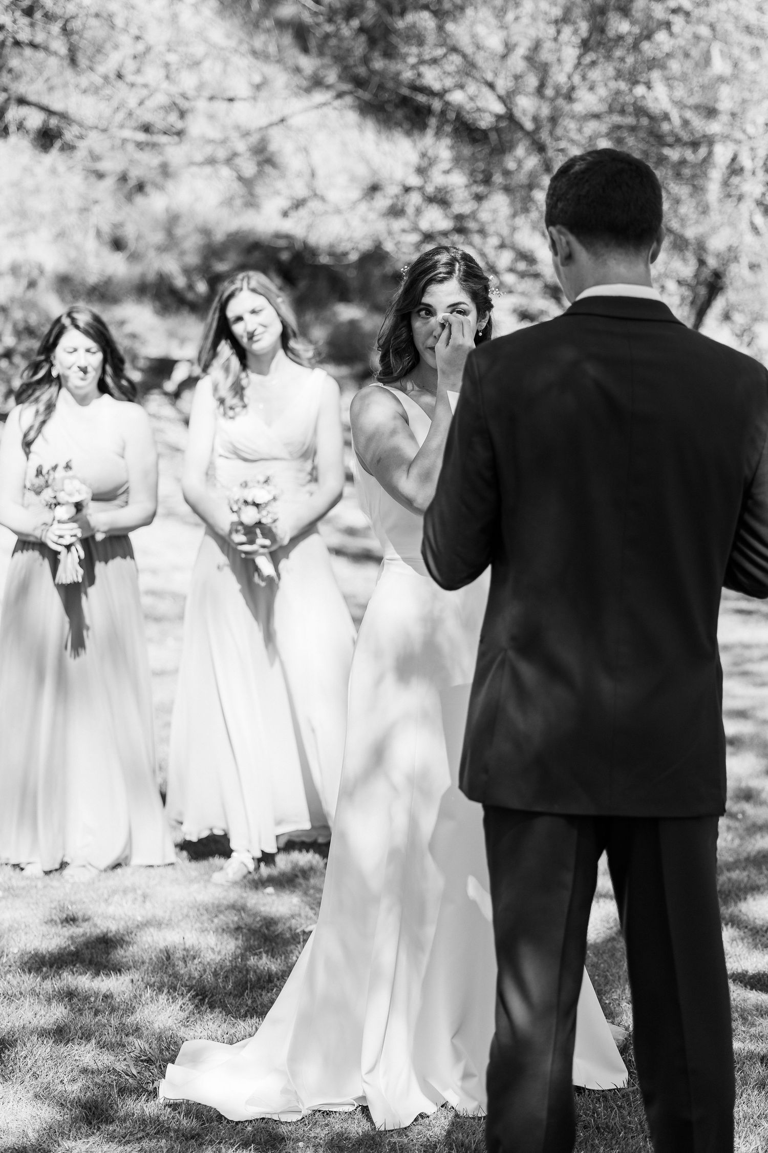 A candid sequence of wedding party photos showing bridesmaids in white dresses reacting joyfully in an outdoor setting.