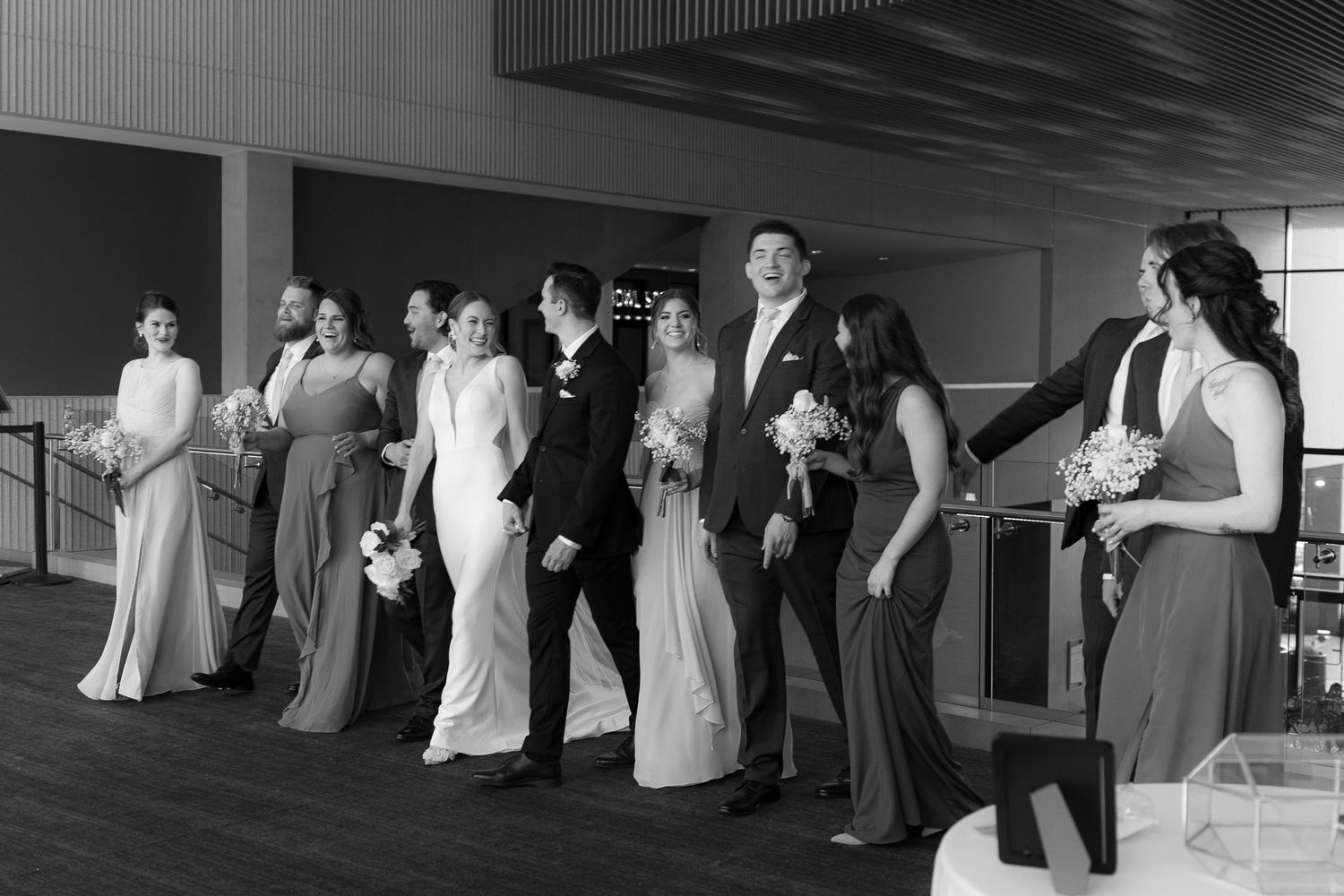 A series of black and white wedding photographs showing couples dancing at a reception.