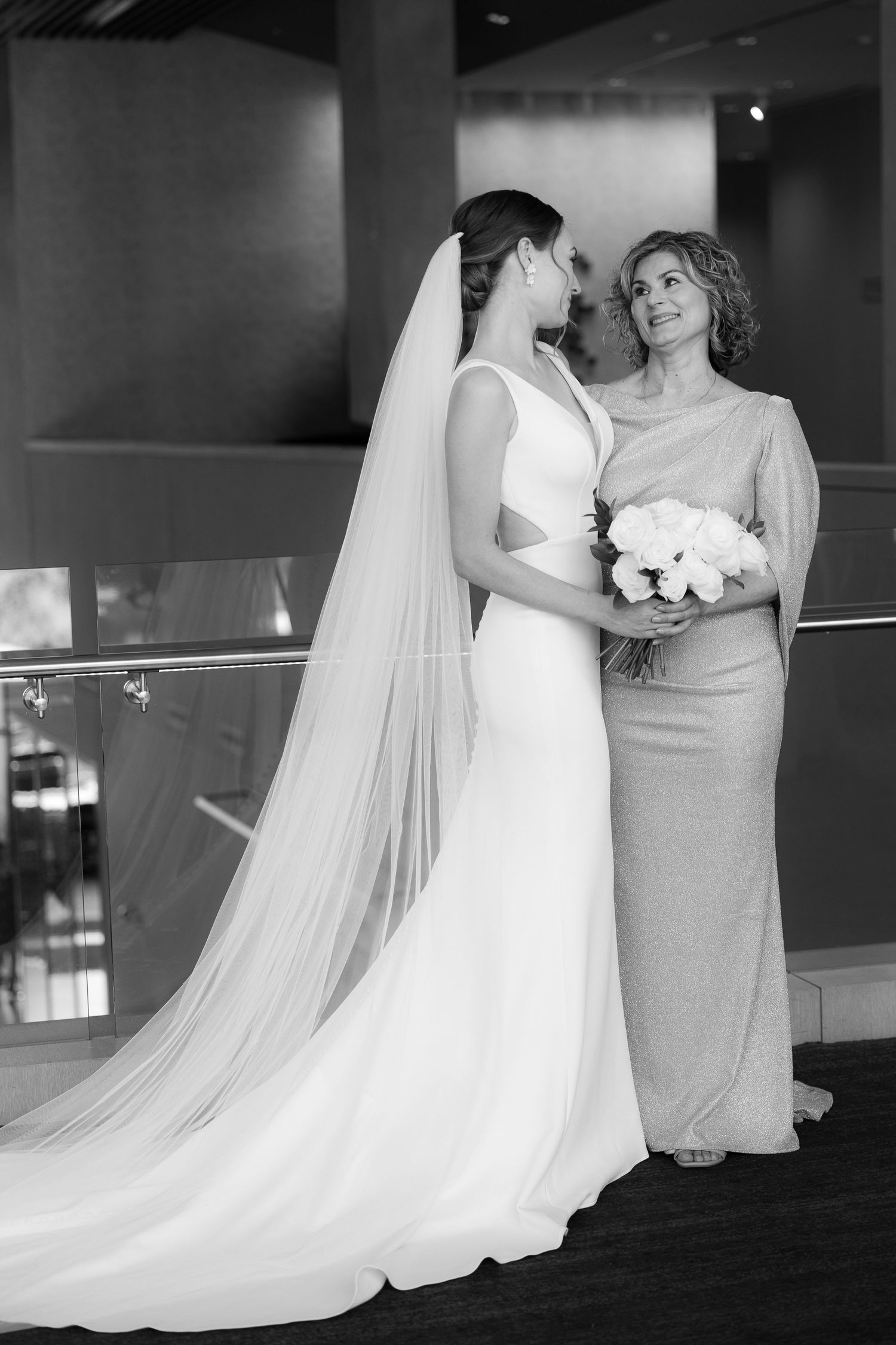 Black and white wedding photography collage showing flowing white veils and bridal gowns in an elegant indoor setting.