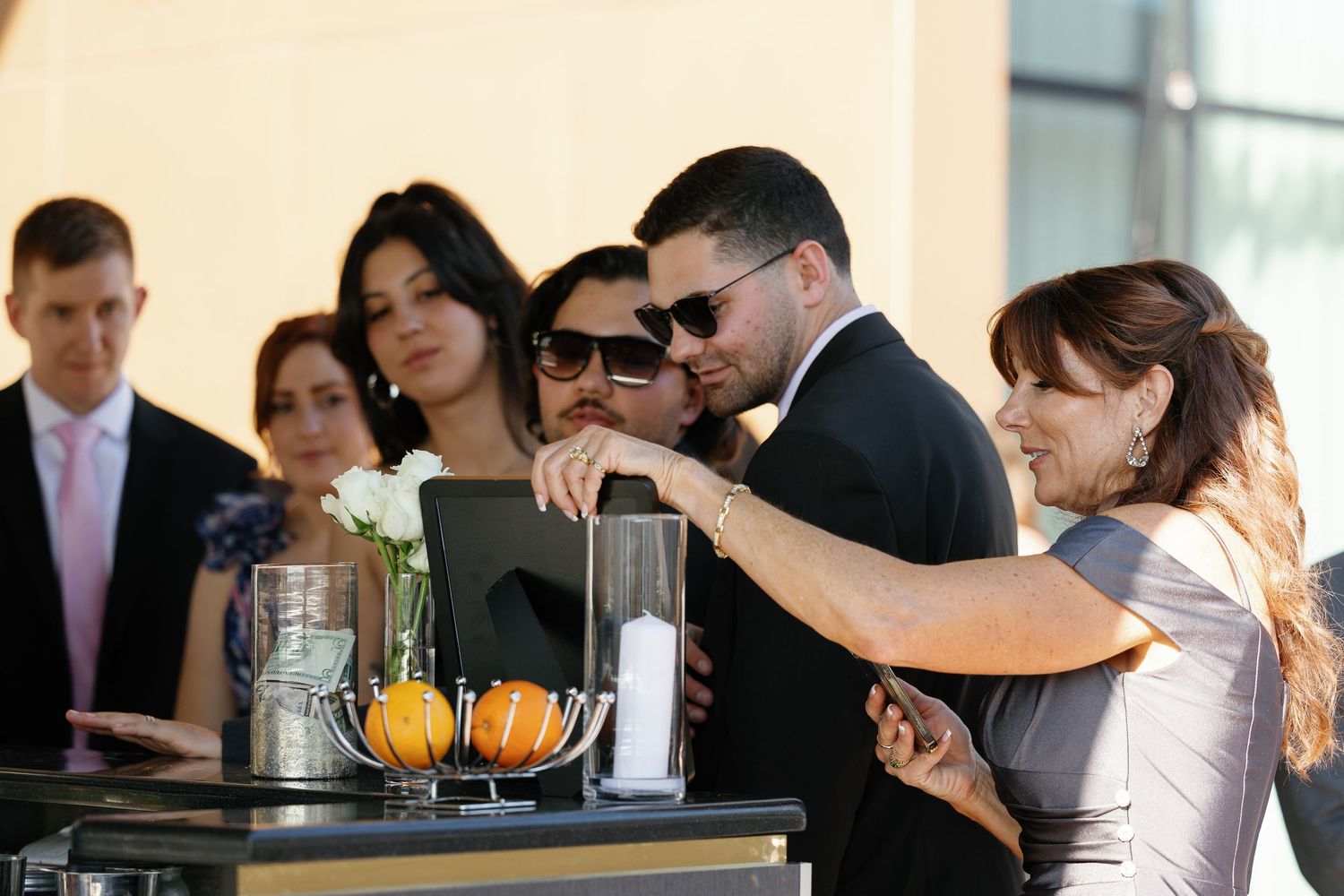 A group of people gathered around a table during a business meeting or workshop session.