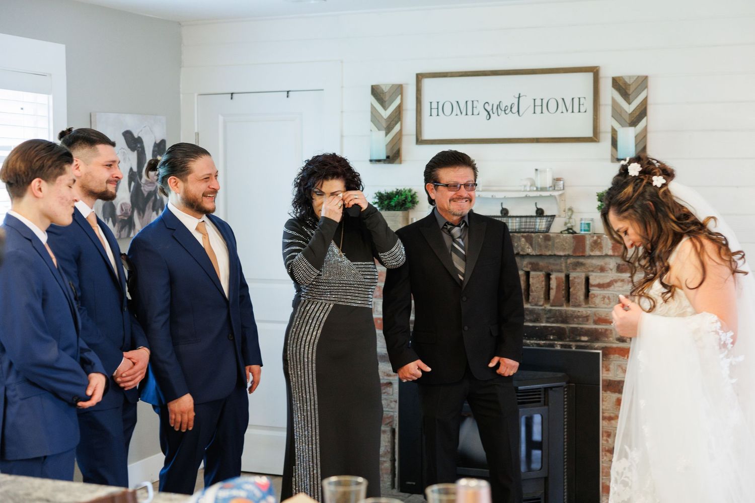 A collection of candid wedding moments showing people laughing and embracing during a celebration.