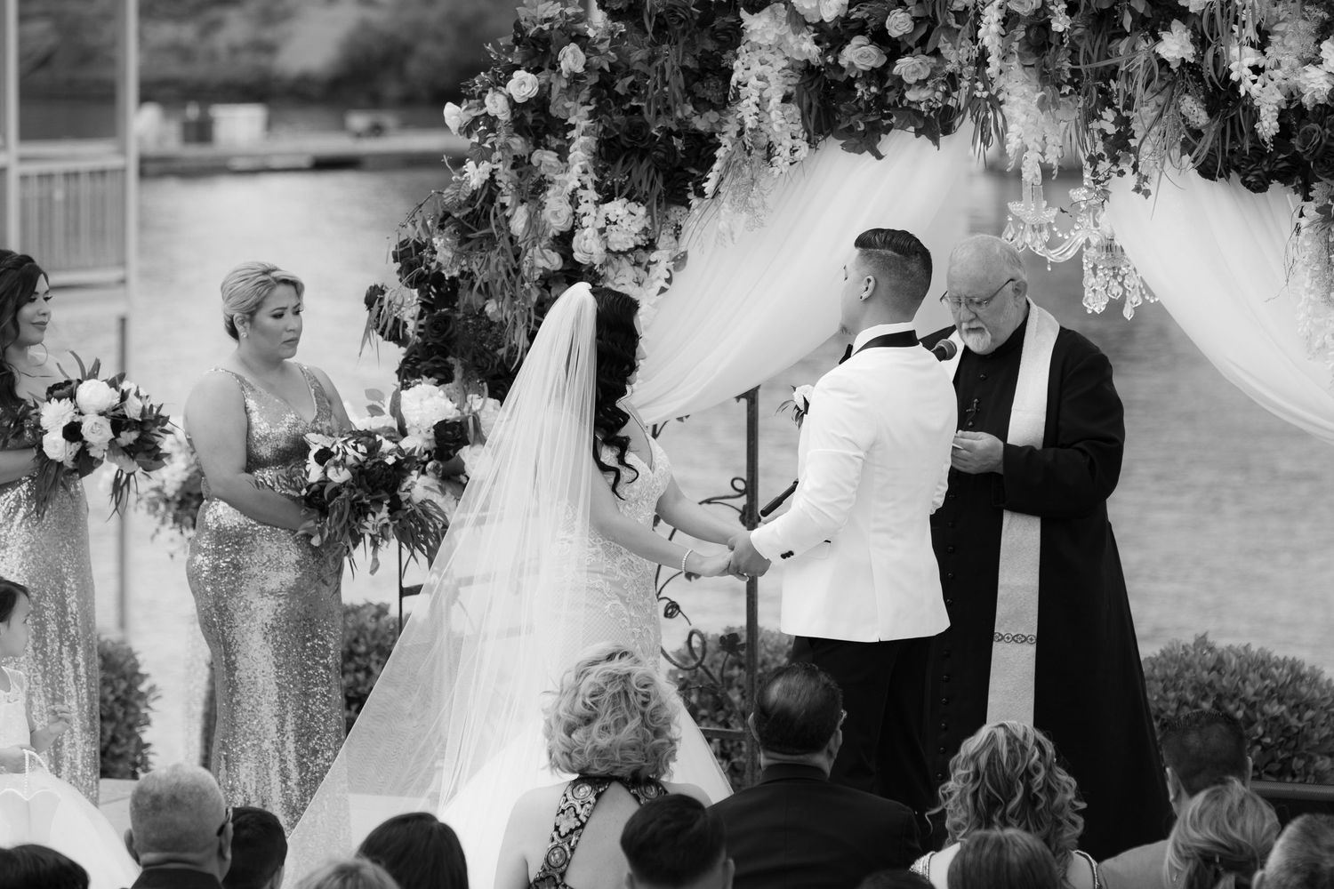 A black and white wedding photo collage showing various moments from a romantic ceremony and celebration.