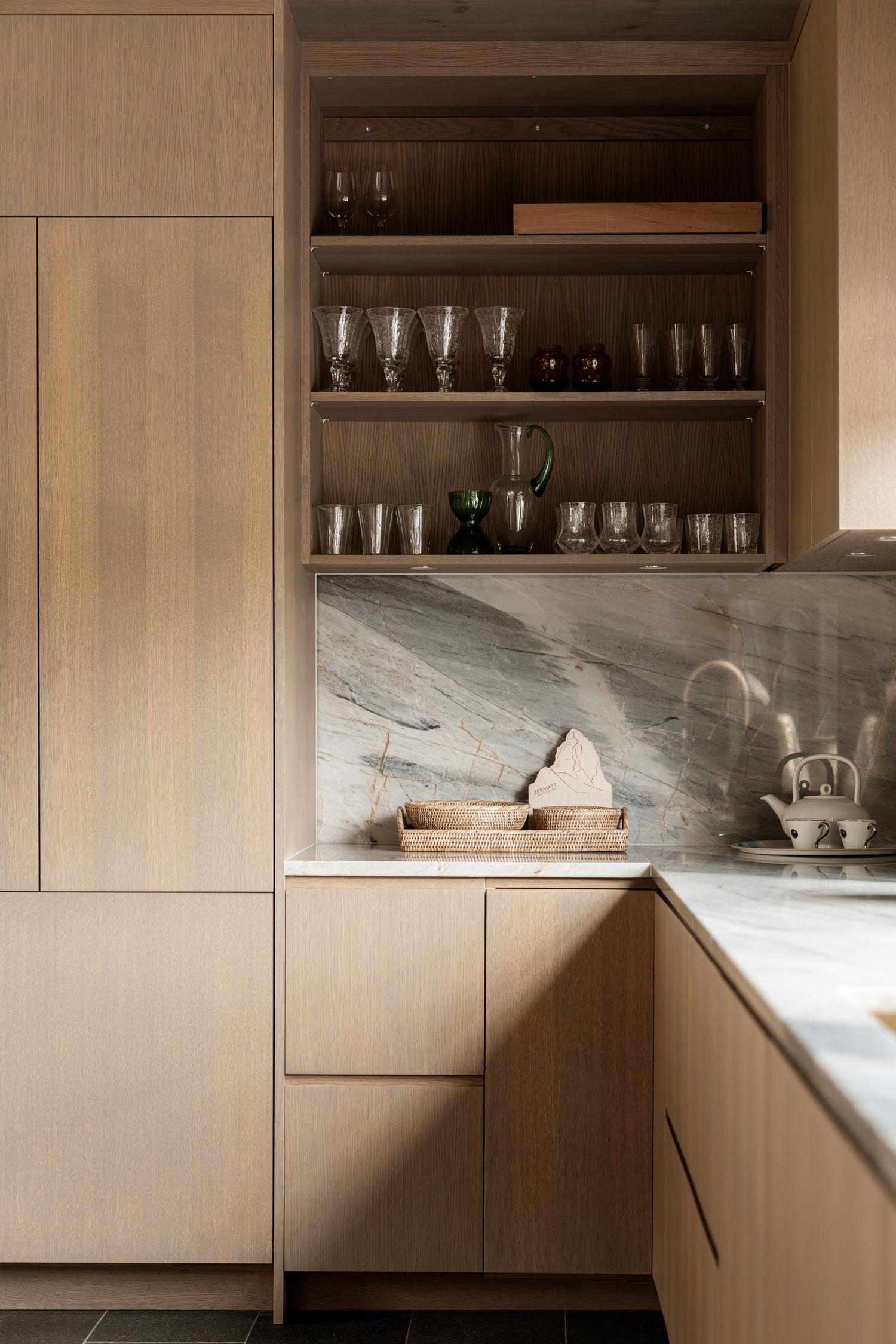Timber cabinets, shelves and stone worktop