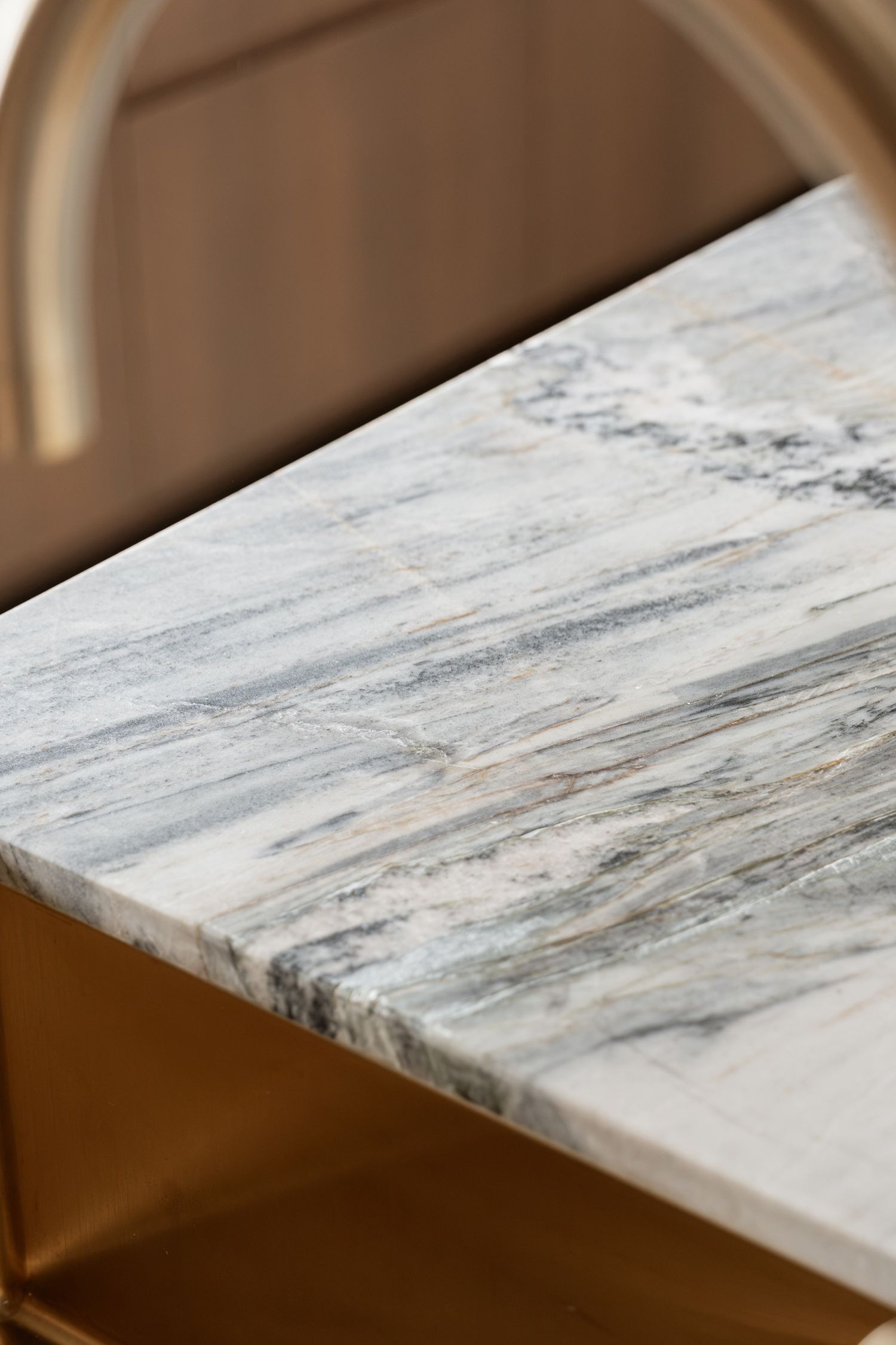 Detail of stone worktop and timber edge