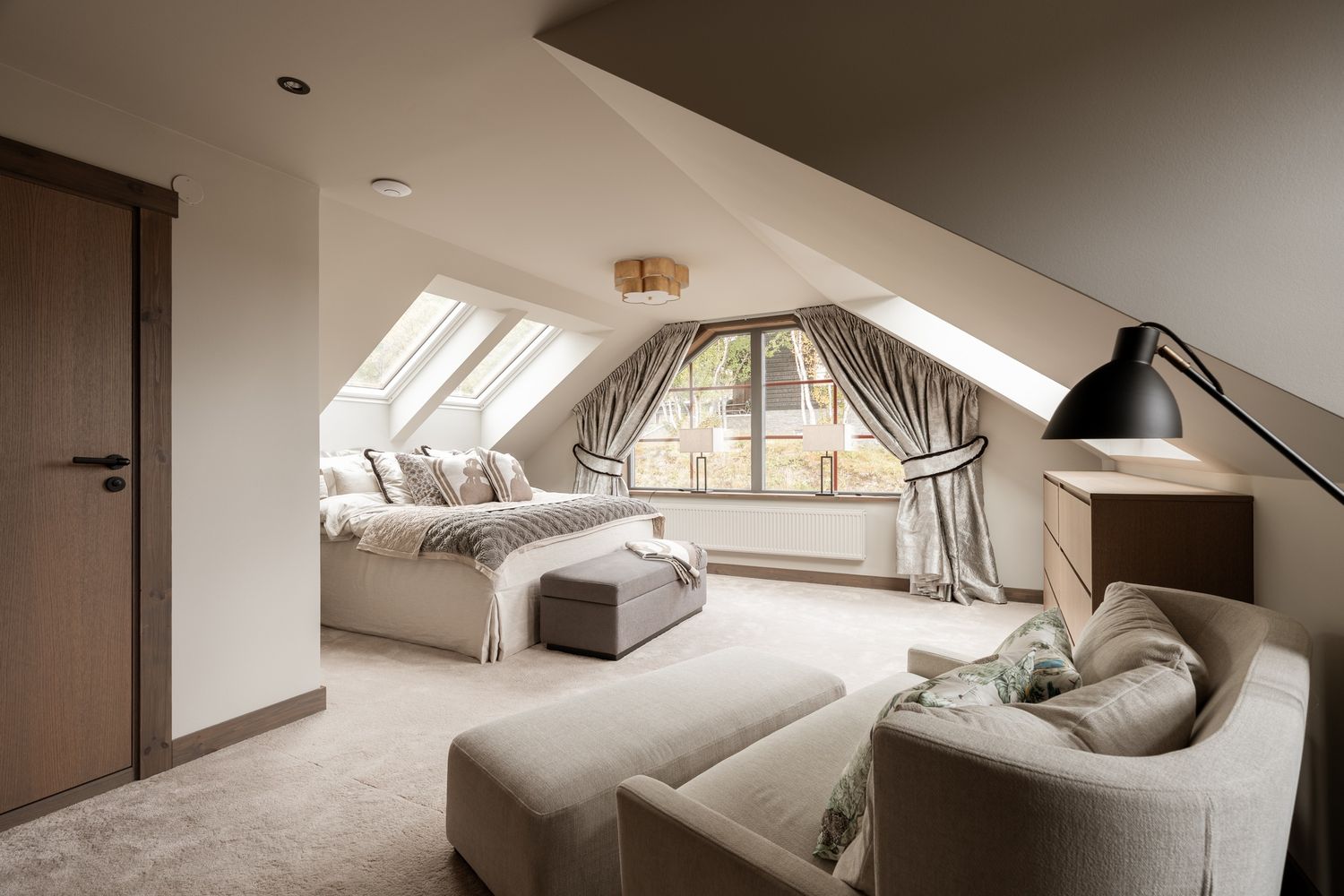 Bedroom suite beneath a sloping ceiling
