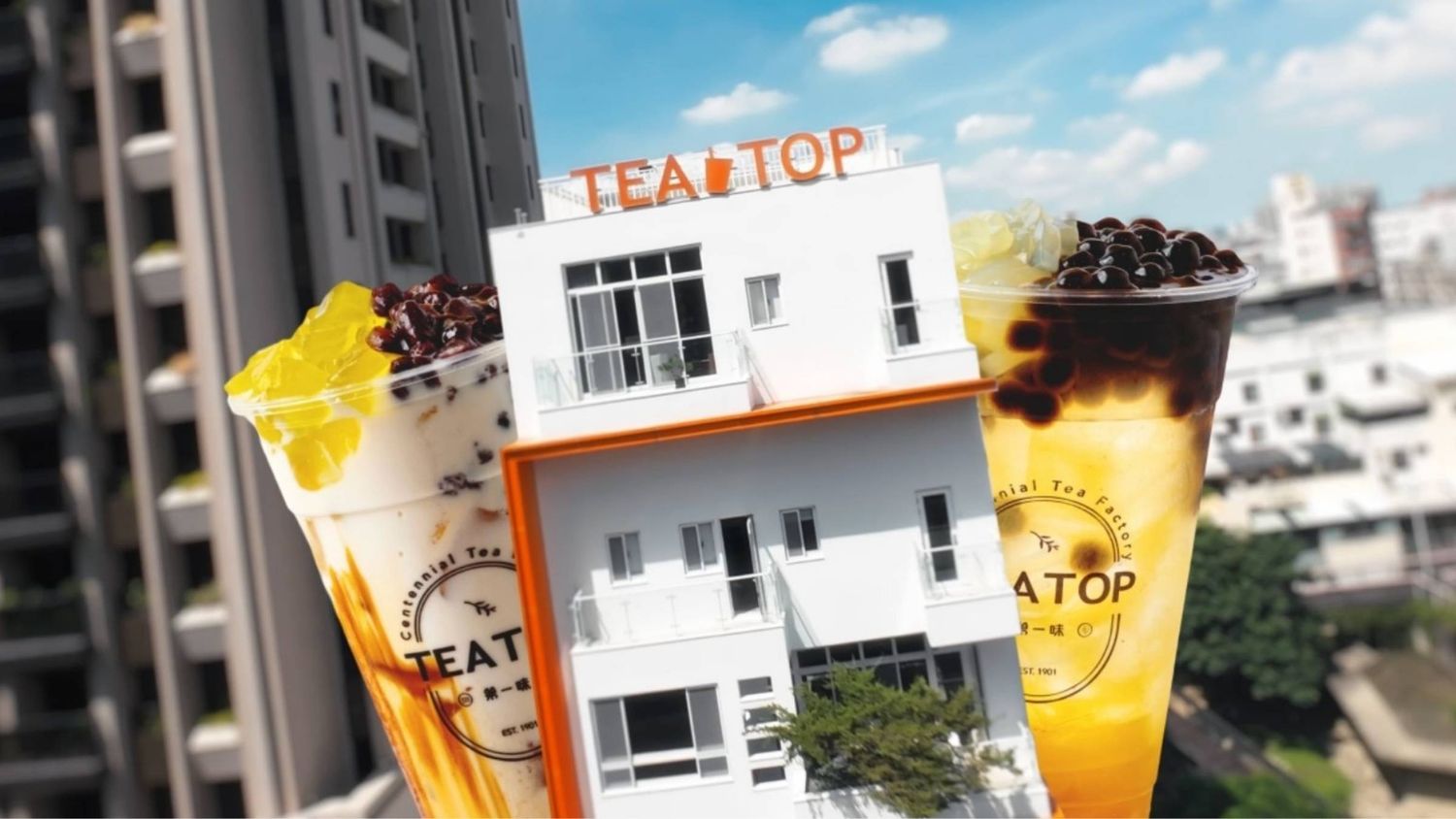 TEA TOP bubble tea shop exterior with colorful boba drinks featuring tapioca pearls and fruit toppings displayed in front.