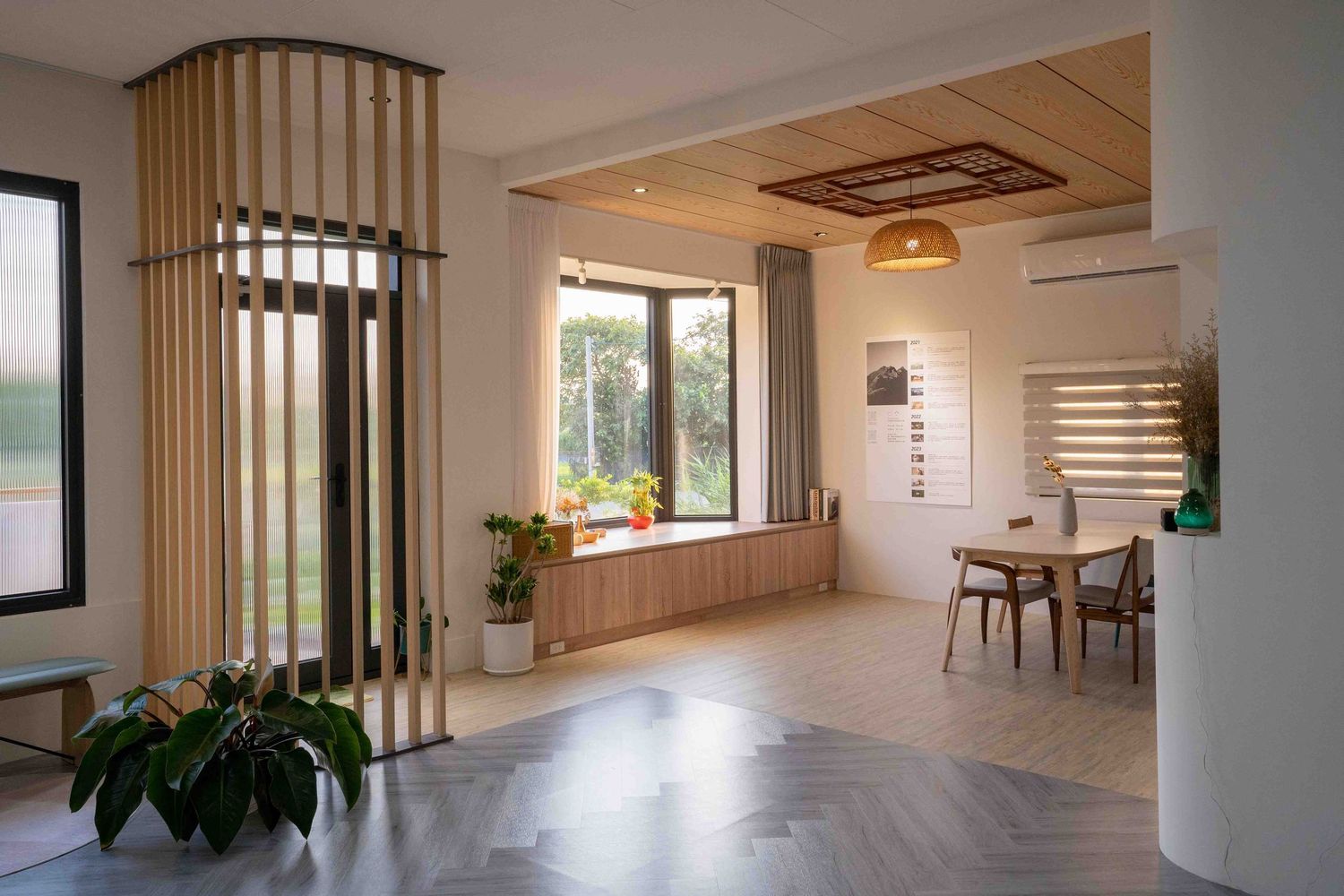 Modern minimalist interior design with wooden vertical slats, white walls, and clean lines throughout an open living space.