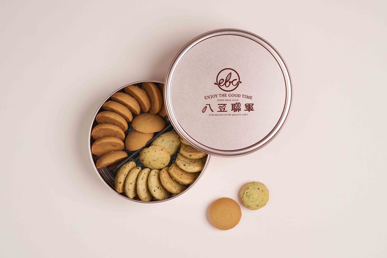A series of minimalist product photos showing round cookie boxes and individual butter cookies against a light background.