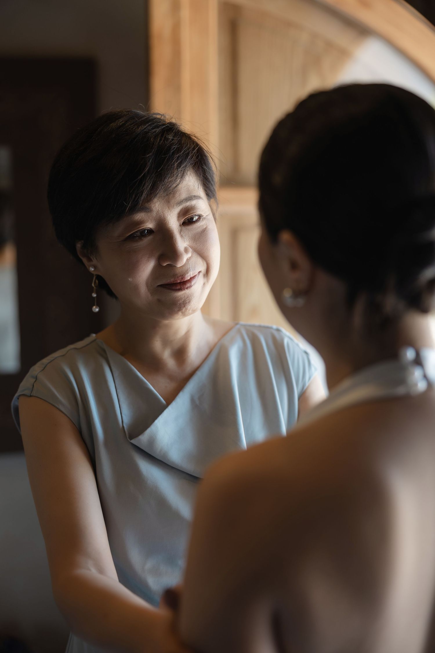 Bride getting ready with her mother