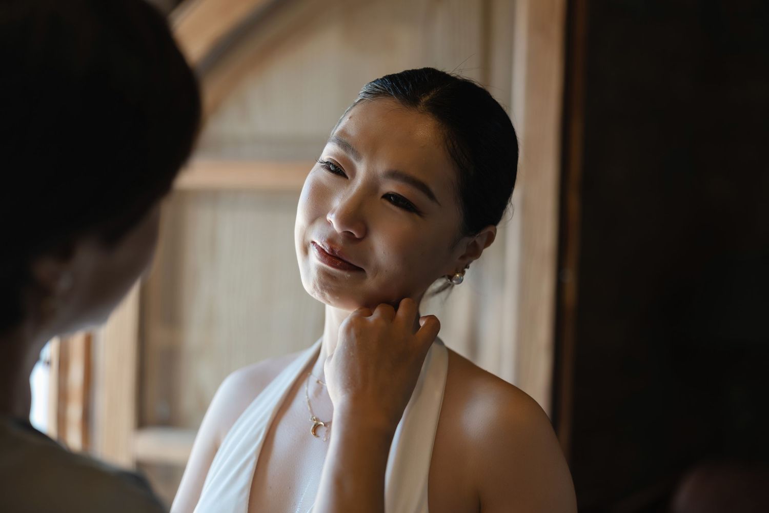 Bride getting ready with her mother