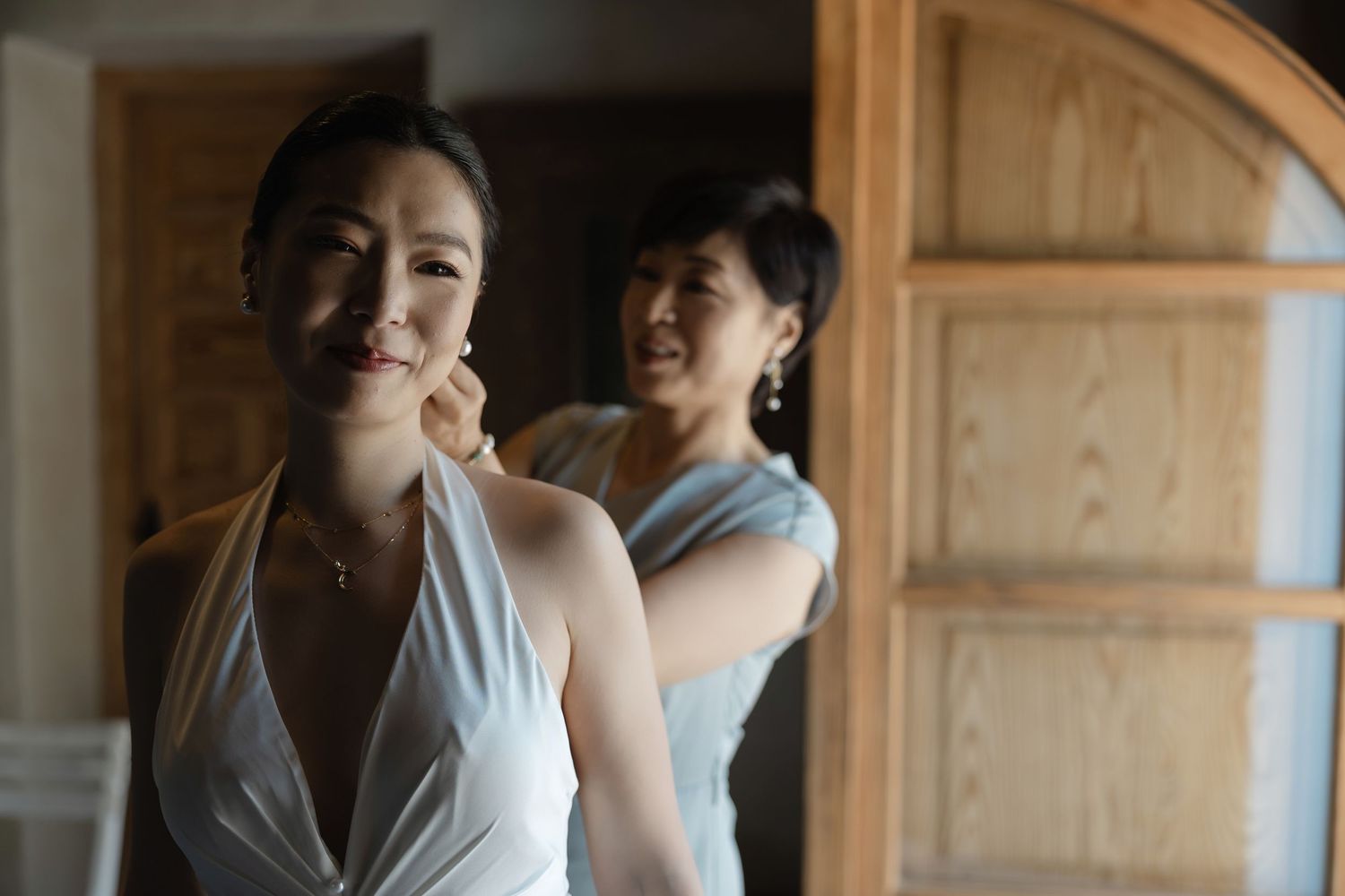 Bride getting ready with her mother