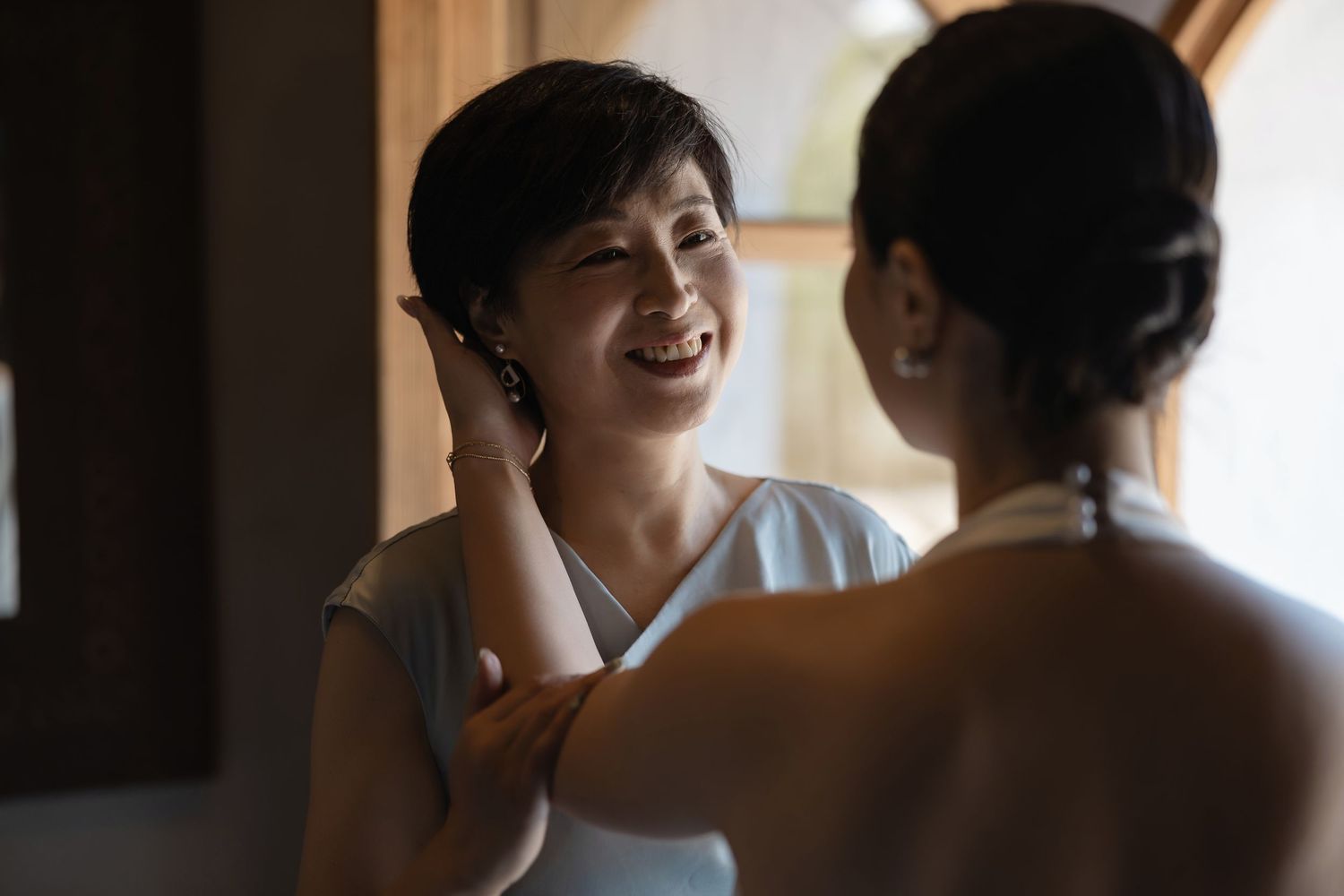 Bride getting ready with her mother