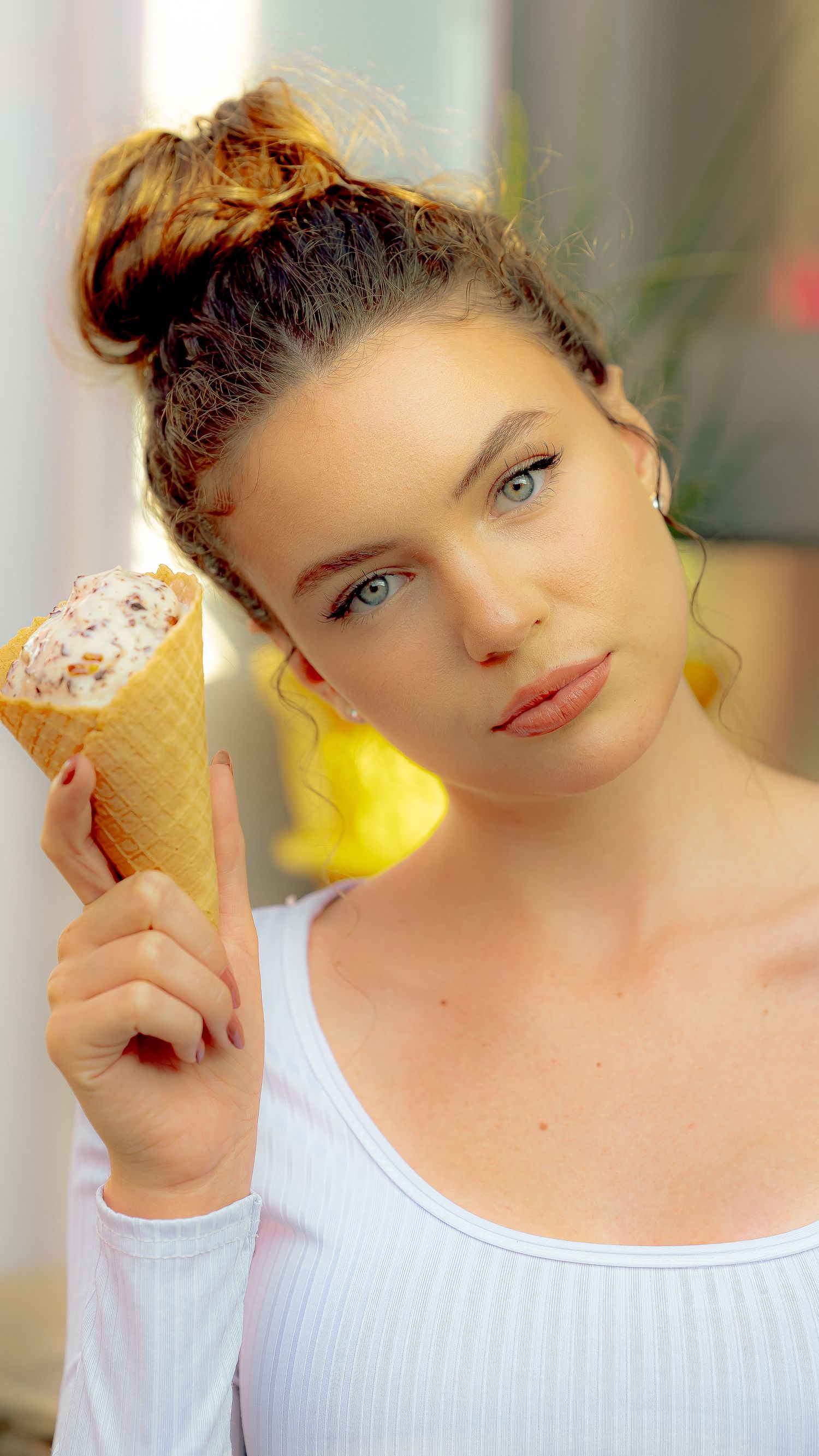 Close-up shots of someone posing with ice cream against a soft background.