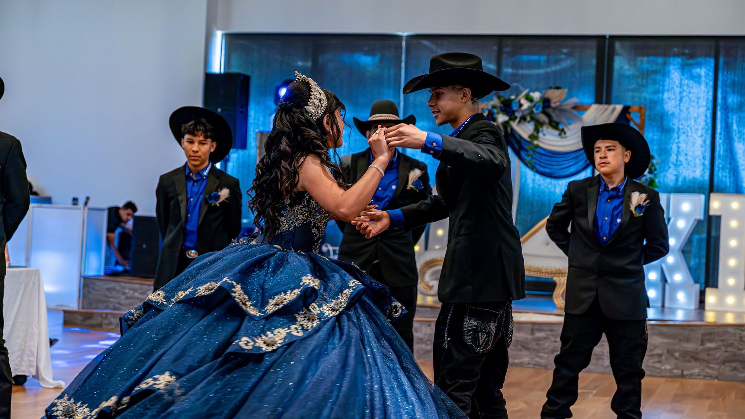 A sequence of dance photos showing elegant movements in navy blue formal attire.
