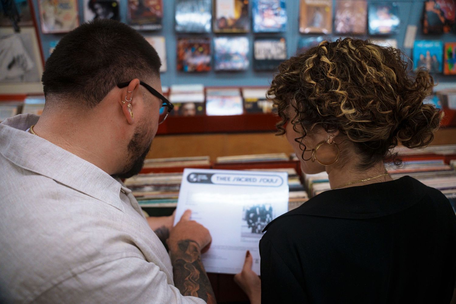 Looking through record albums in a vintage music shop.