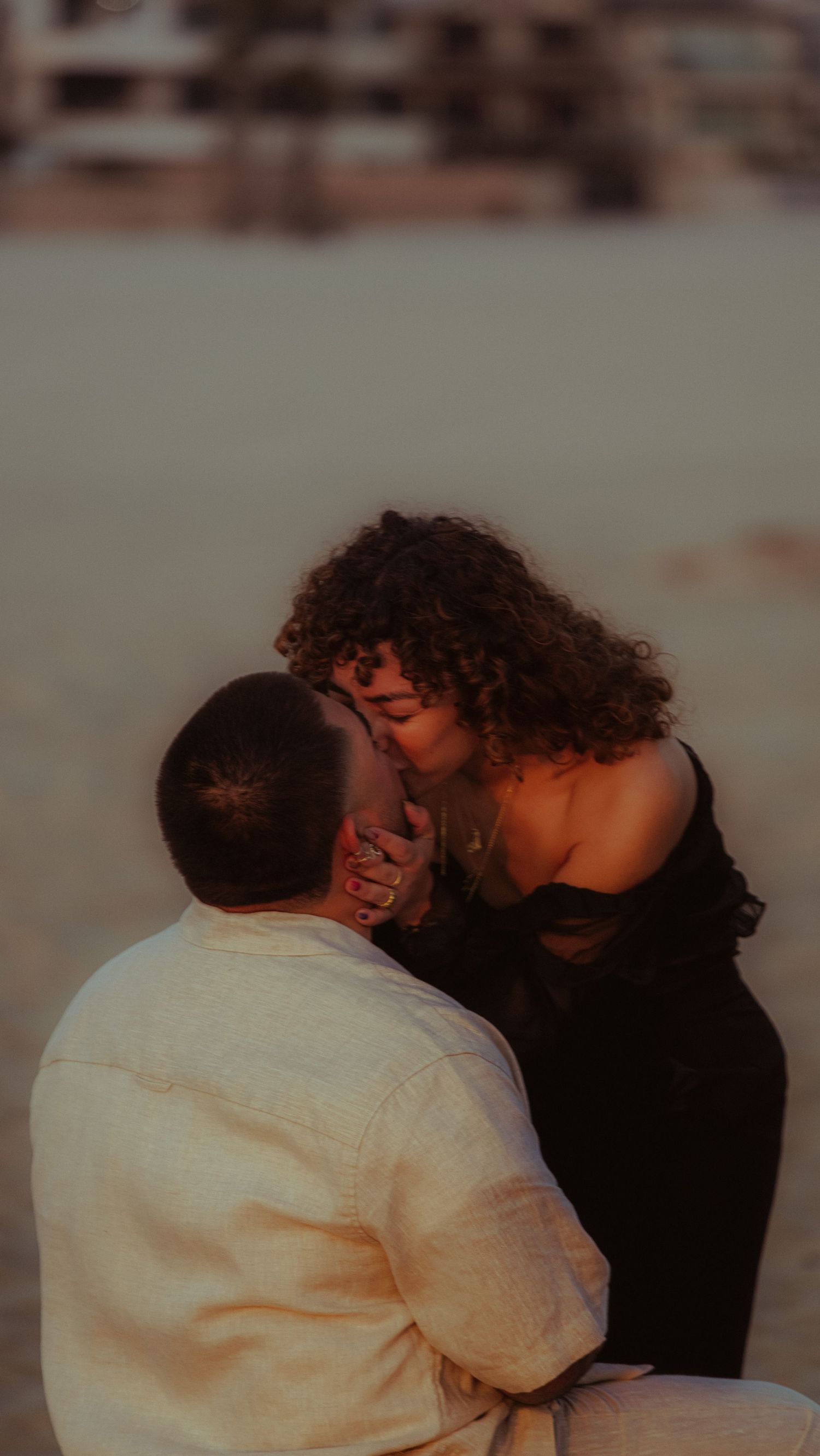 A romantic couple embraces in a series of intimate black and white photographs.