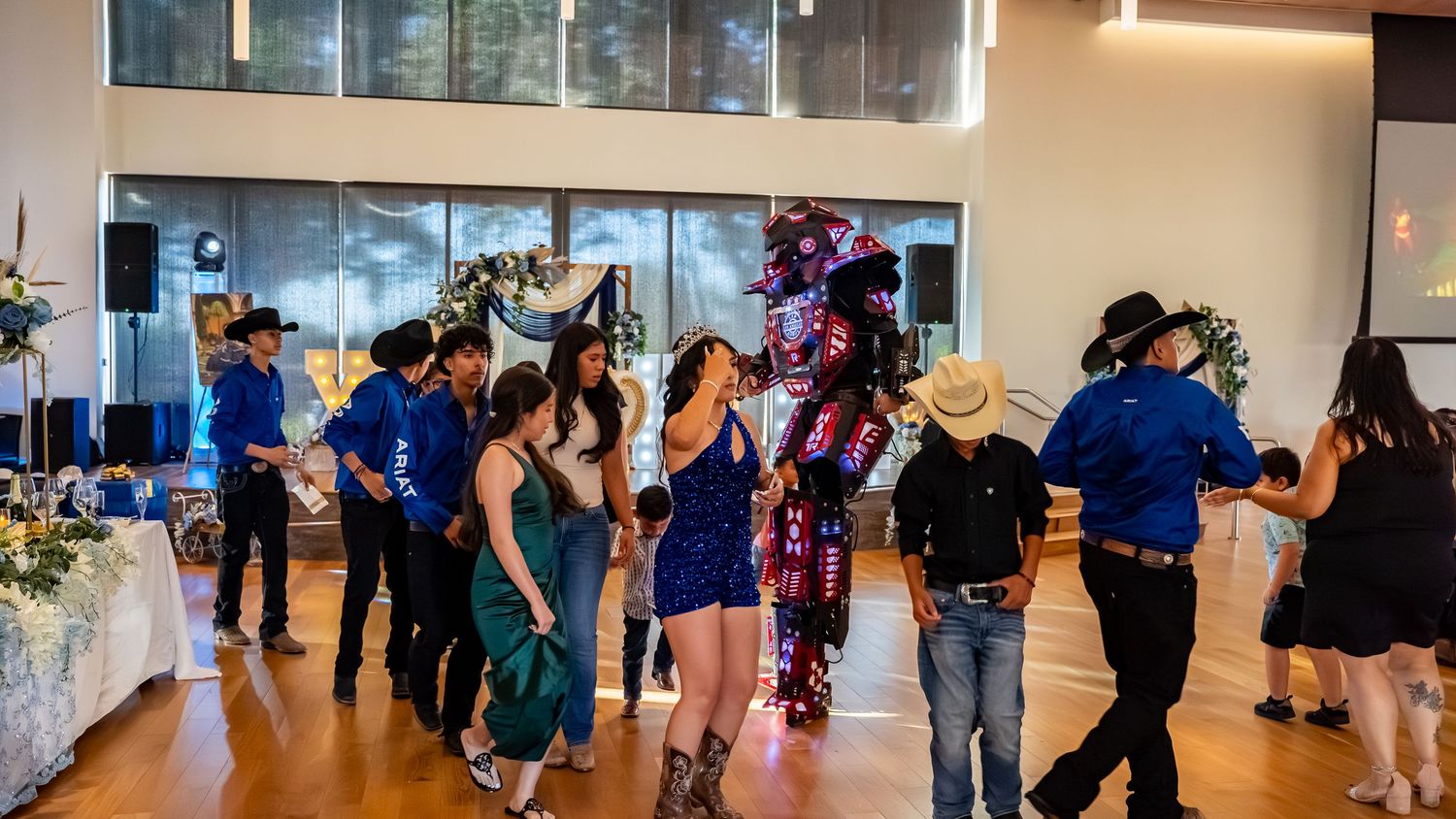 Dance studio panorama showing multiple groups practicing different dance moves.