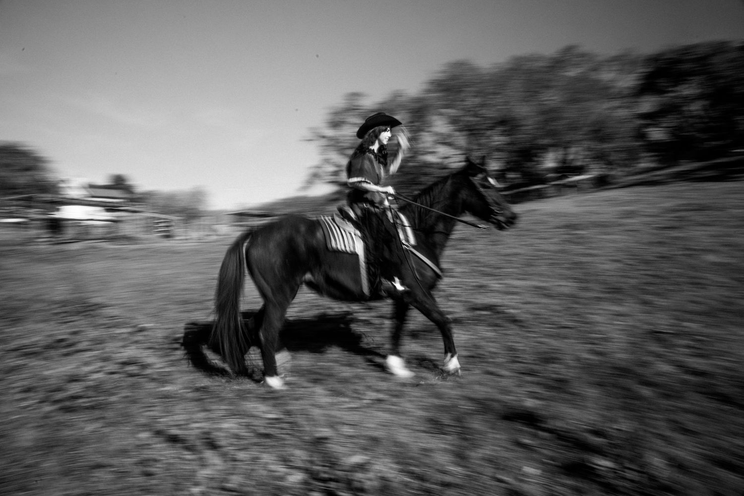 A sequence of black and white action shots showing a horse and rider galloping across a field at high speed.