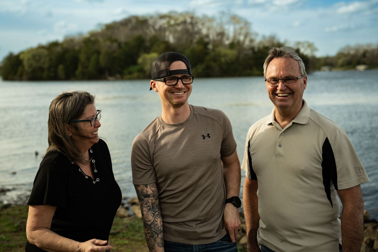 family portrait session photographed by Ross Image Works in Nashville Tennessee

family standing together during outdoor portrait session

n