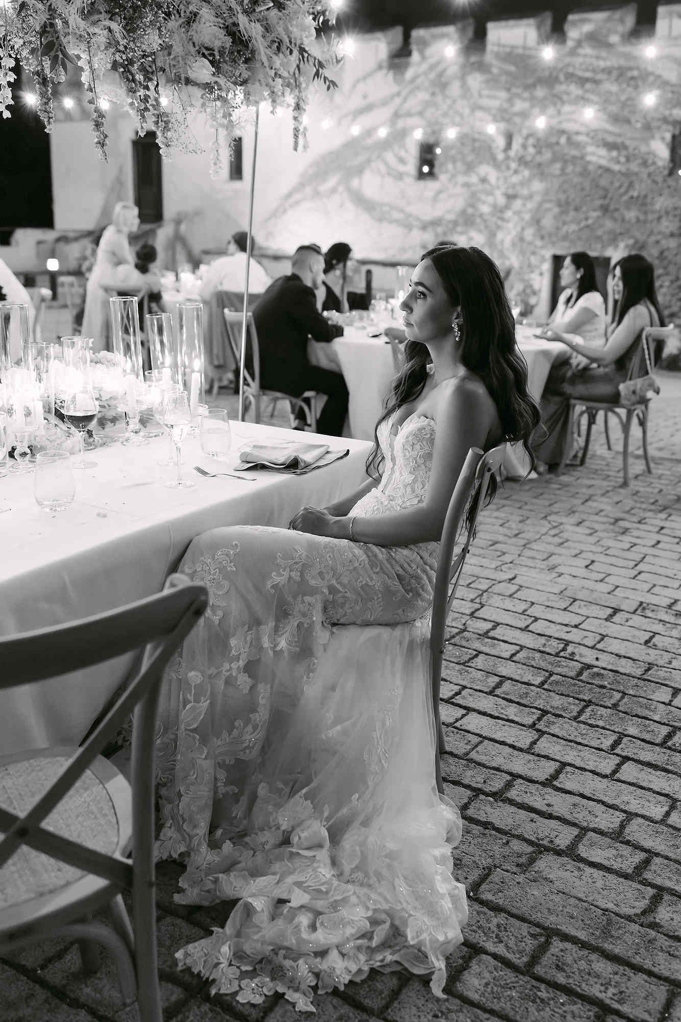 The bride at her evening wedding banquet, demonstrating the perfect longevity of her Hollywood waves and professional styling.
