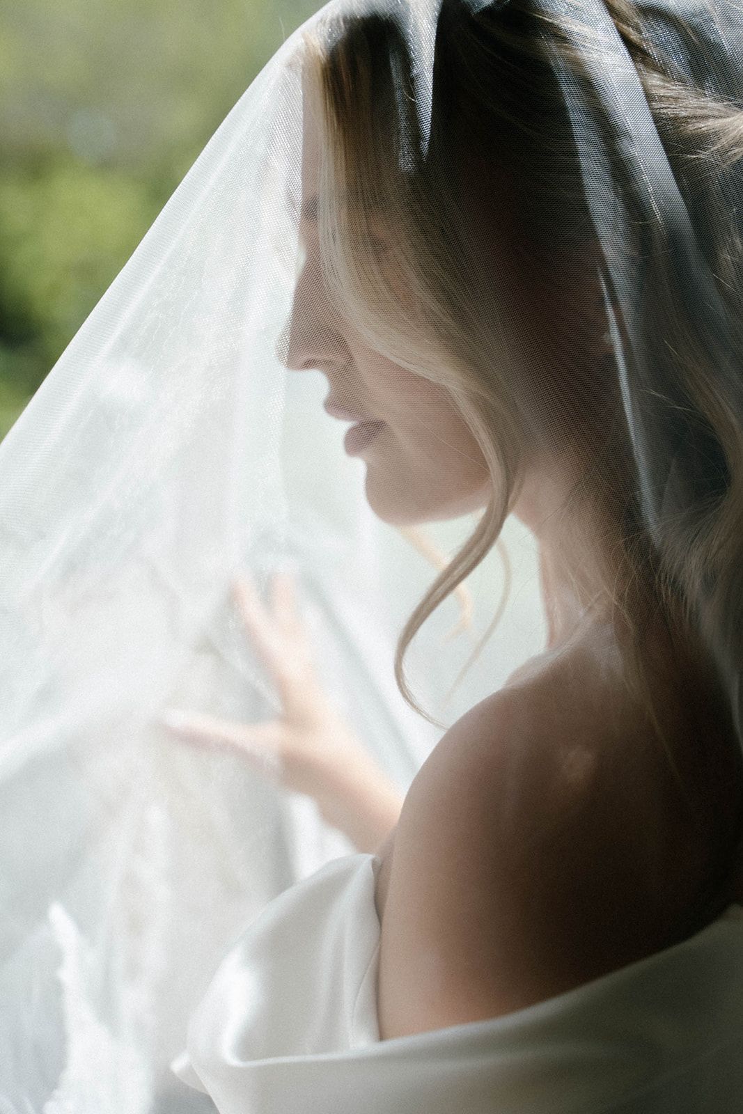 Artistic bridal silhouette captured under a delicate wedding veil at the historic Finca Marqués de Montemolar in Altea, Costa Blanca.