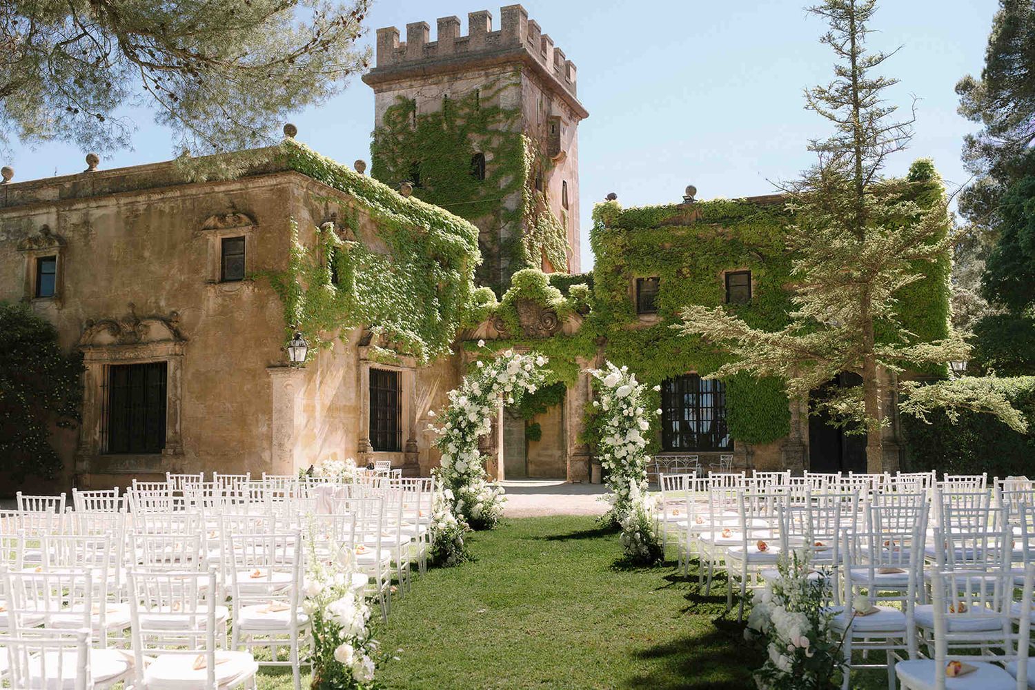 Beautifully decorated outdoor wedding ceremony area at Finca Torrefiel in Spain, waiting for guests before the grand celebration.