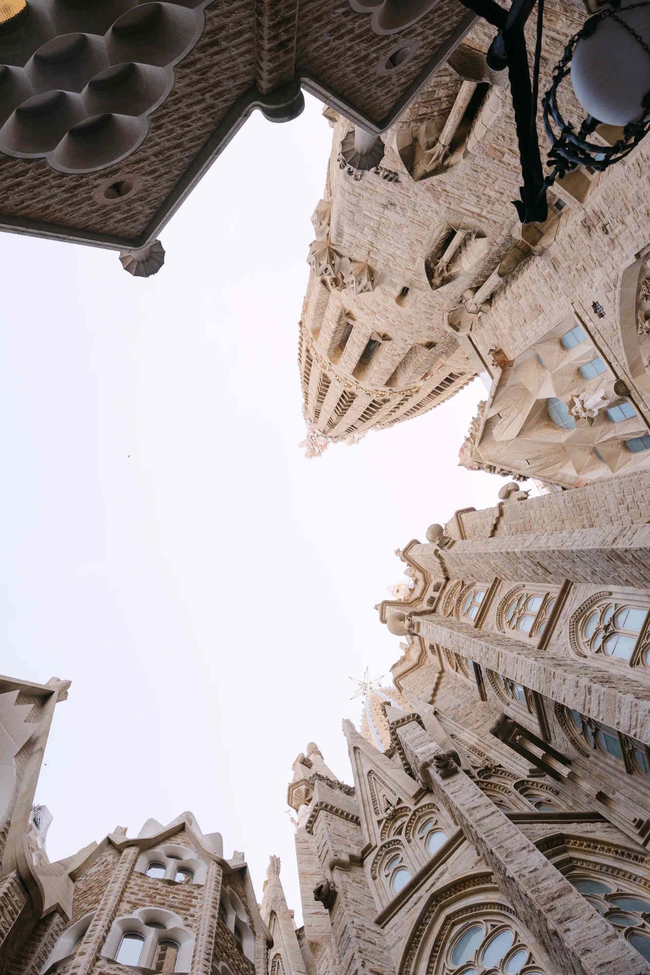 A majestic low-angle shot of the Sagrada Família spires, capturing the iconic architecture of Barcelona’s landmark.